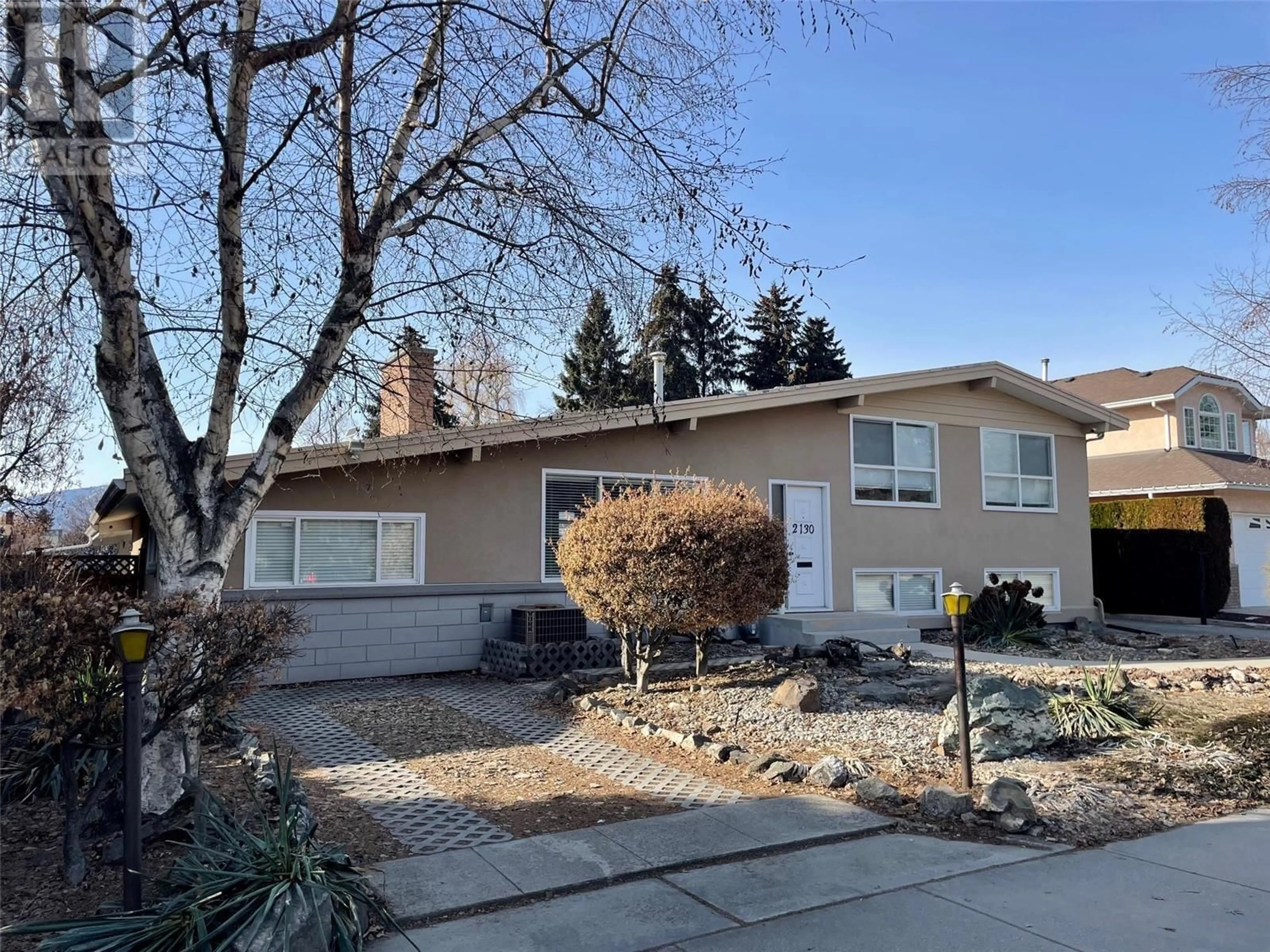 Home with vinyl exterior material, street for 2130 BURTCH ROAD, Kelowna British Columbia V1Y4B5