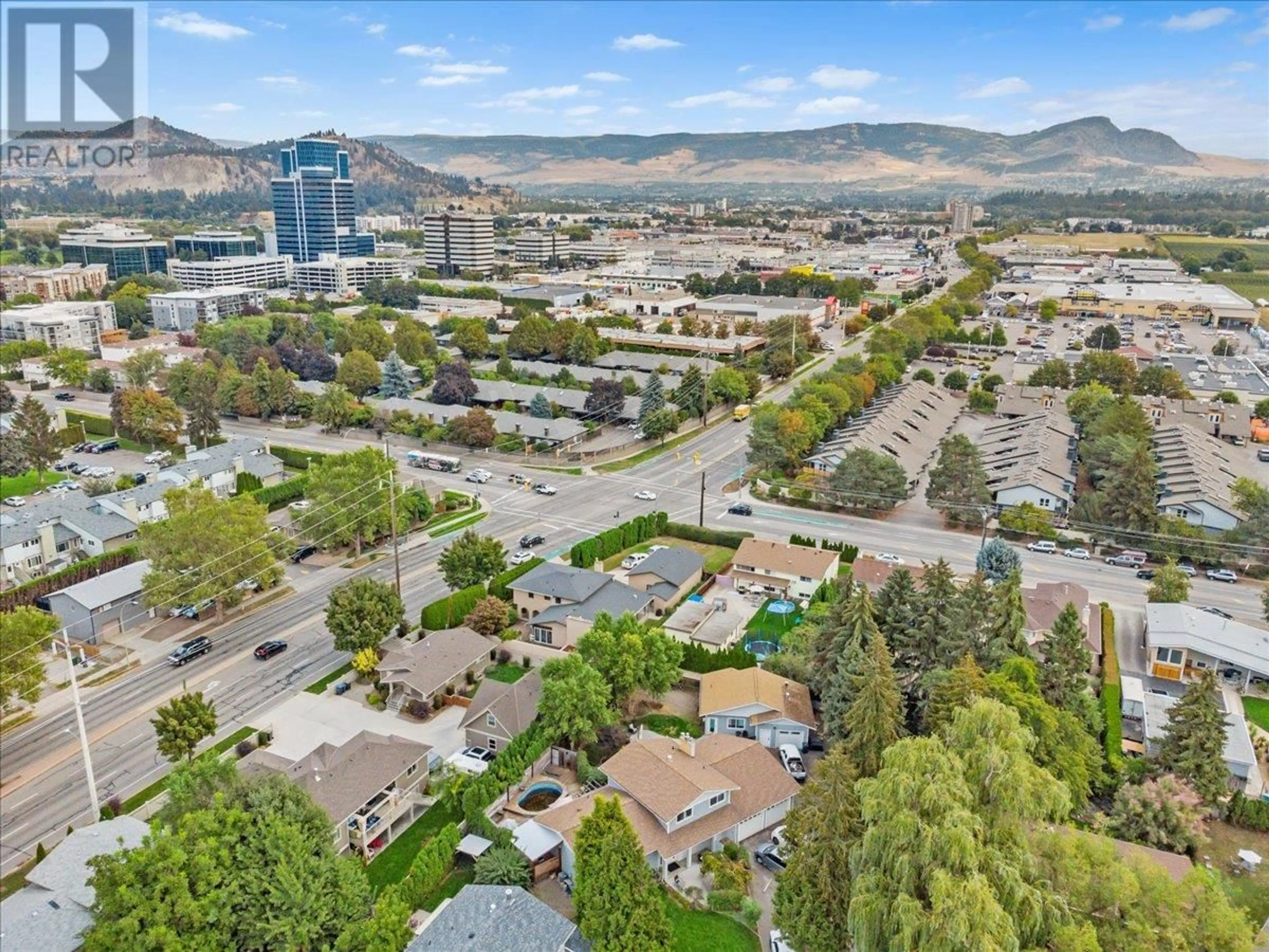 A pic from outside/outdoor area/front of a property/back of a property/a pic from drone, mountain view for 2130 BURTCH ROAD, Kelowna British Columbia V1Y4B5