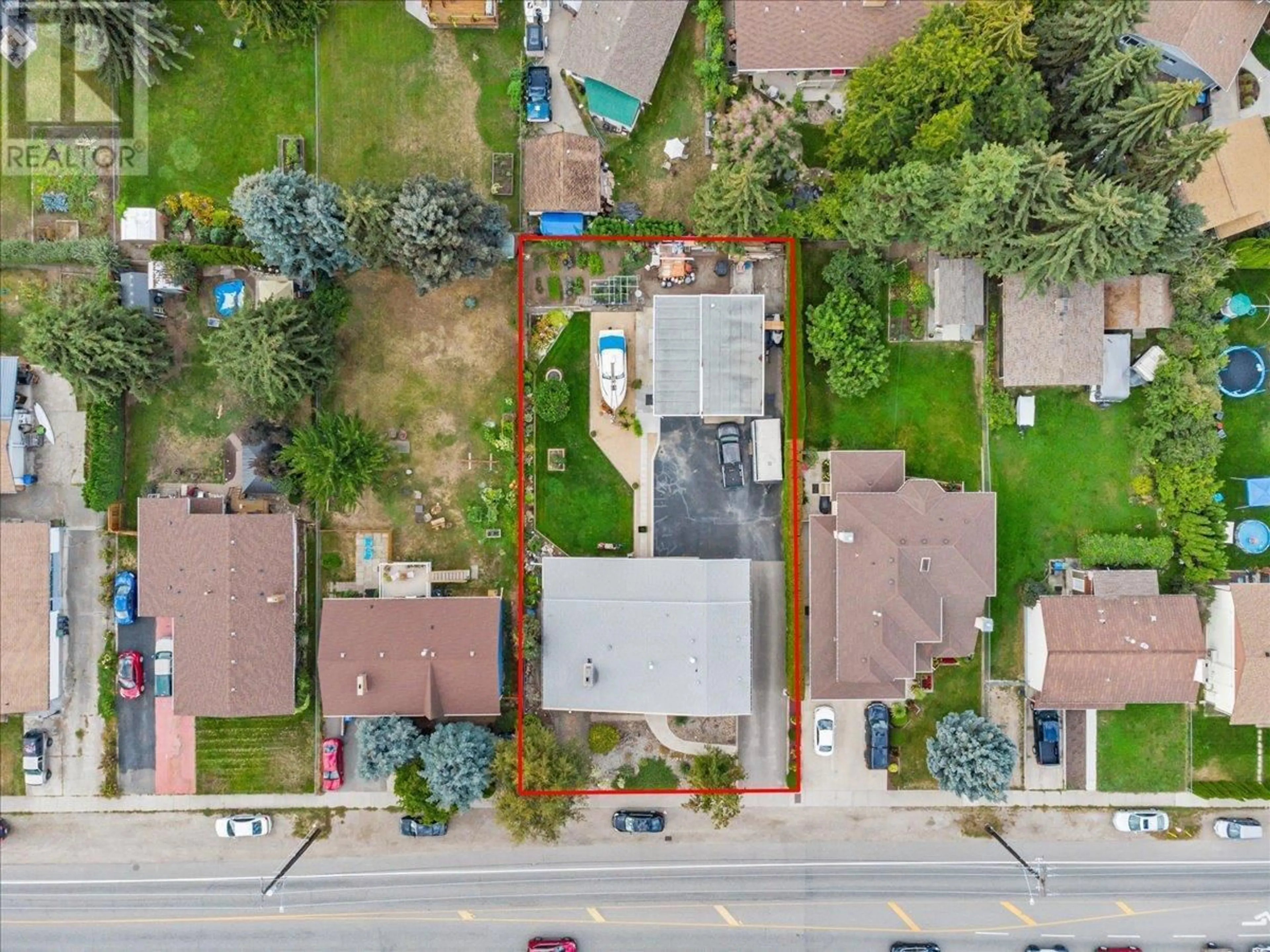 A pic from outside/outdoor area/front of a property/back of a property/a pic from drone, street for 2130 BURTCH ROAD, Kelowna British Columbia V1Y4B5