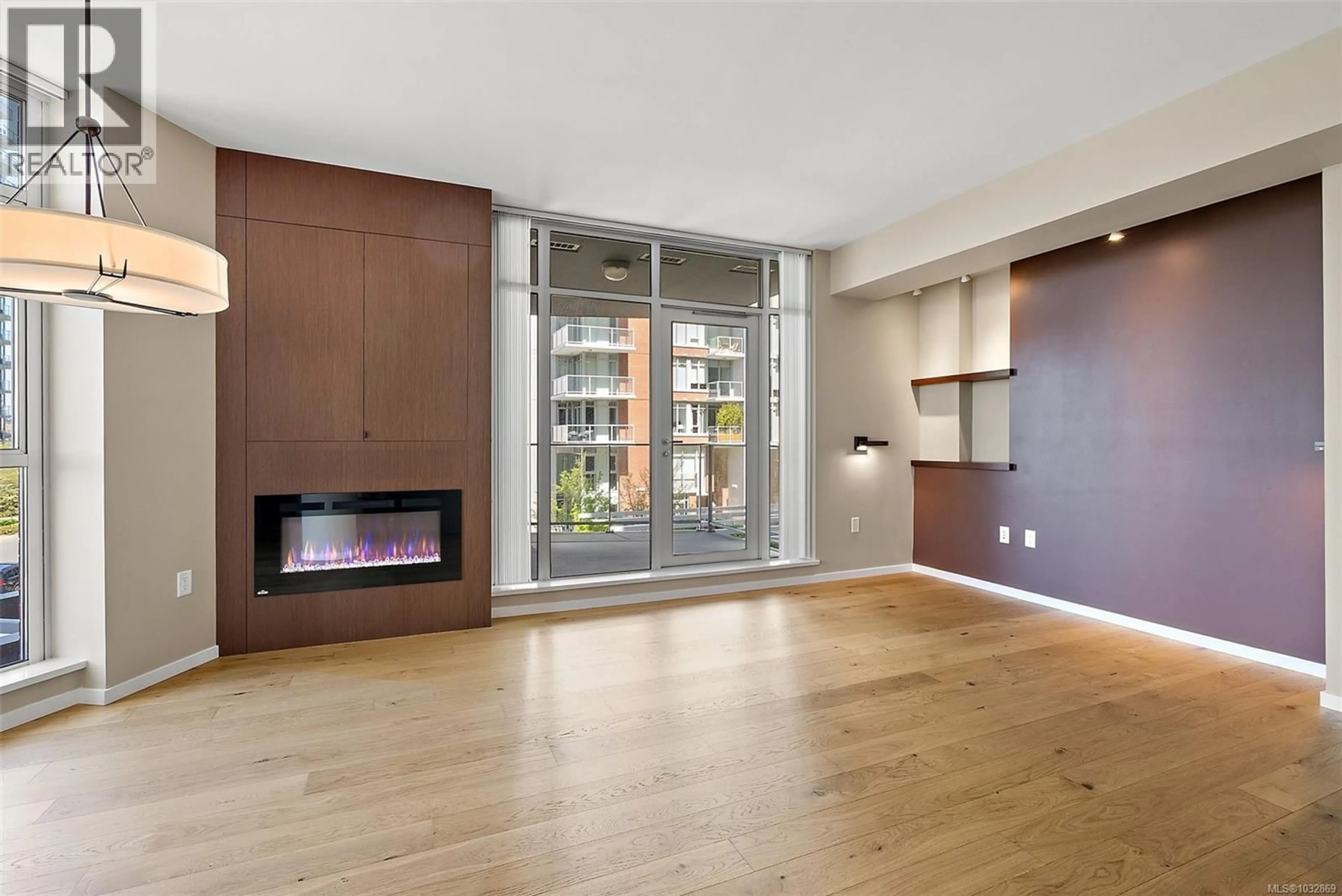 Living room with furniture, wood/laminate floor for 205 - 100 SAGHALIE ROAD, Victoria British Columbia V9A0A1