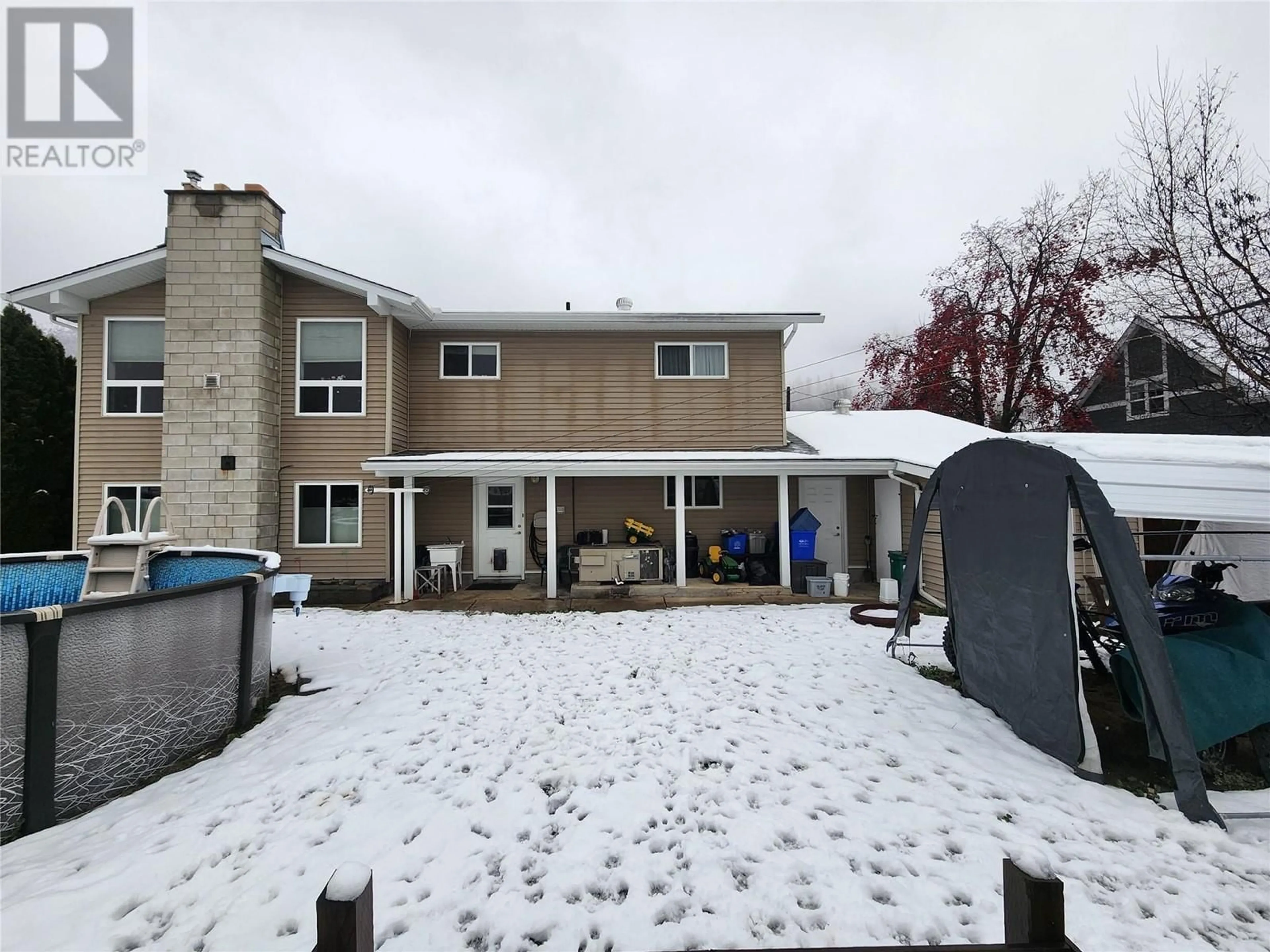 Frontside or backside of a home, the fenced backyard for 875 10TH Avenue, Montrose British Columbia V0G1P0