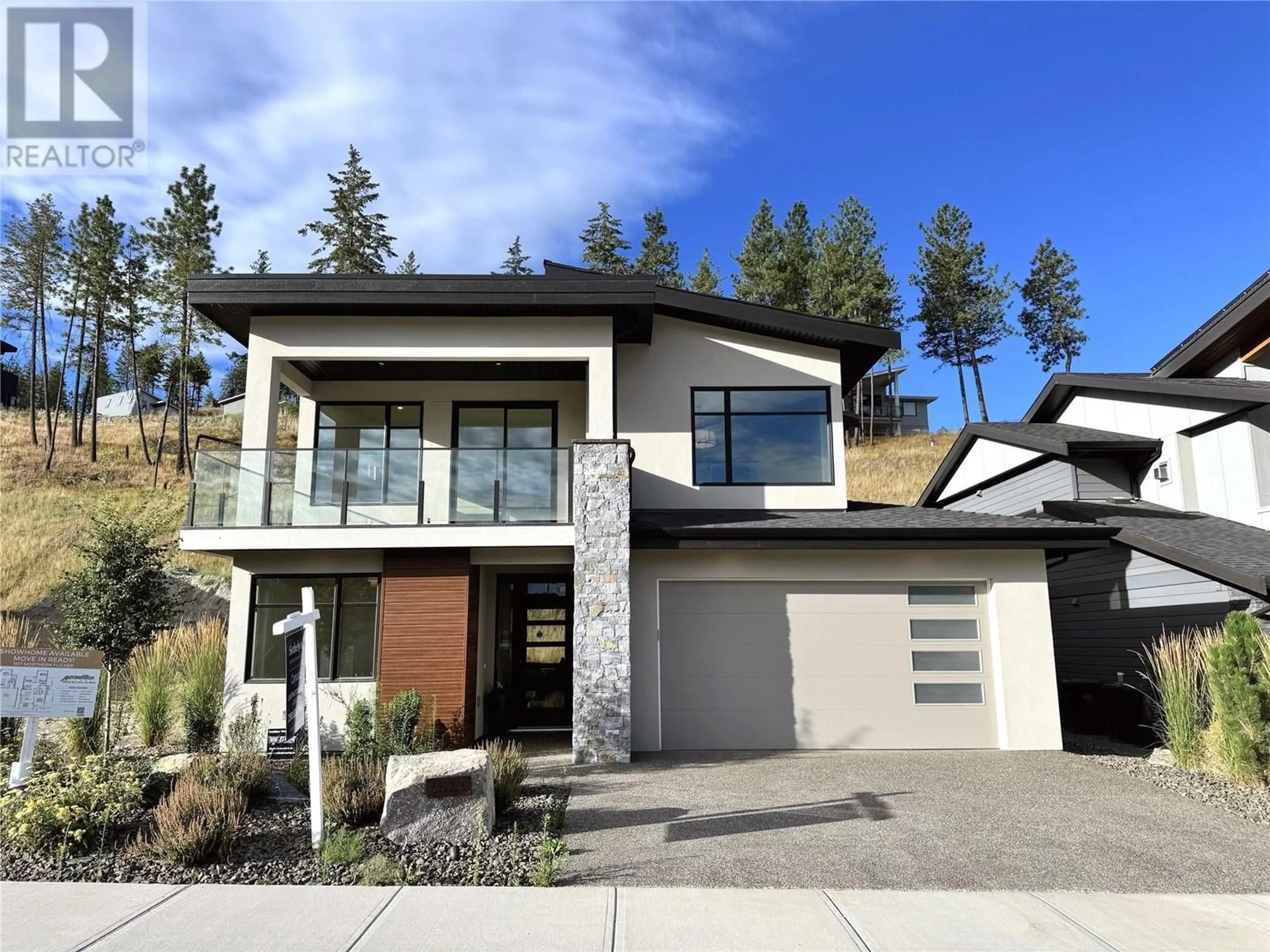 Frontside or backside of a home, mountain for 1917 Northern Flicker Court, Kelowna British Columbia V1V0G3