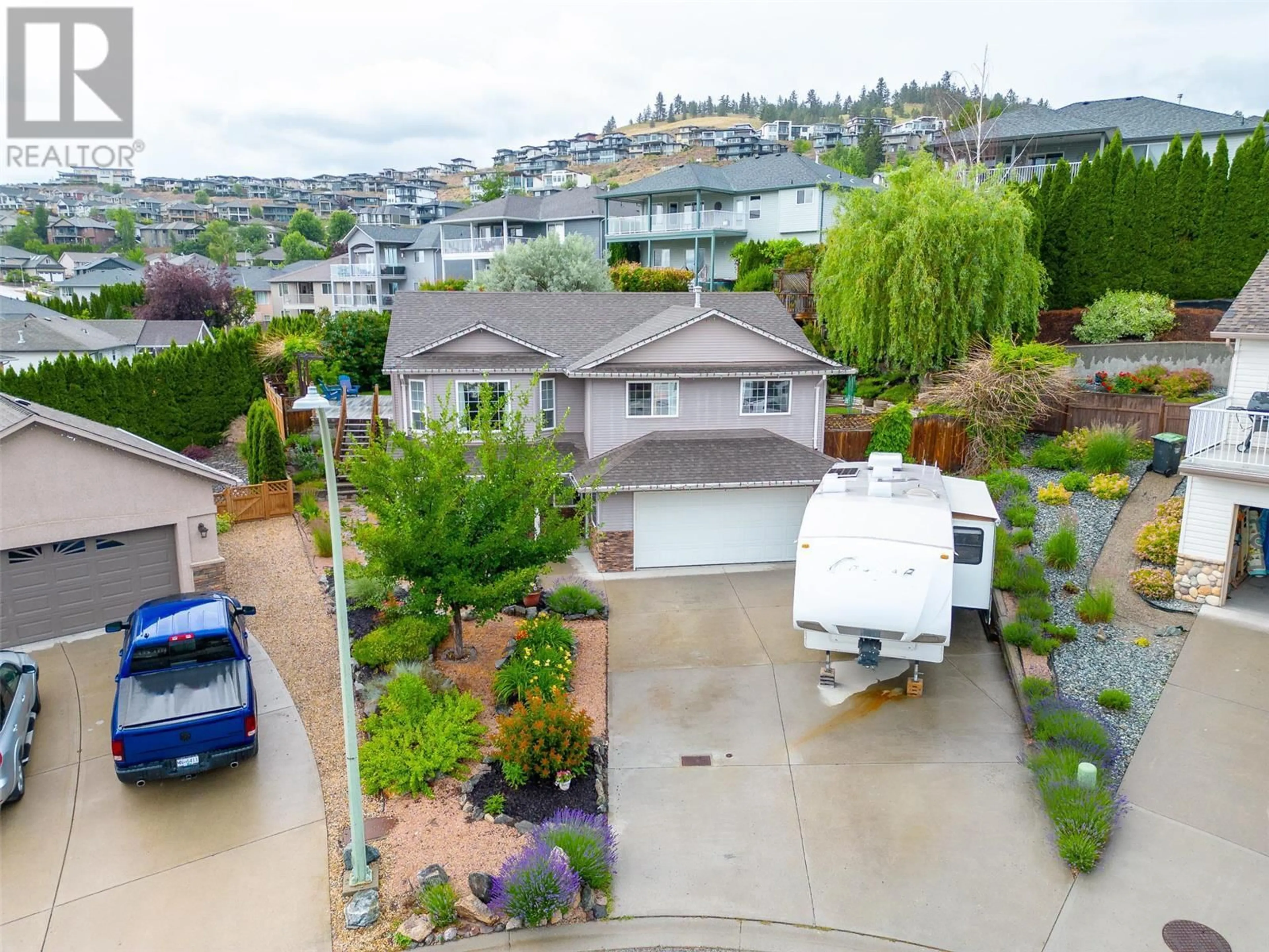 Frontside or backside of a home, the street view for 1650 Wilmot Court, Kelowna British Columbia V1P1M8