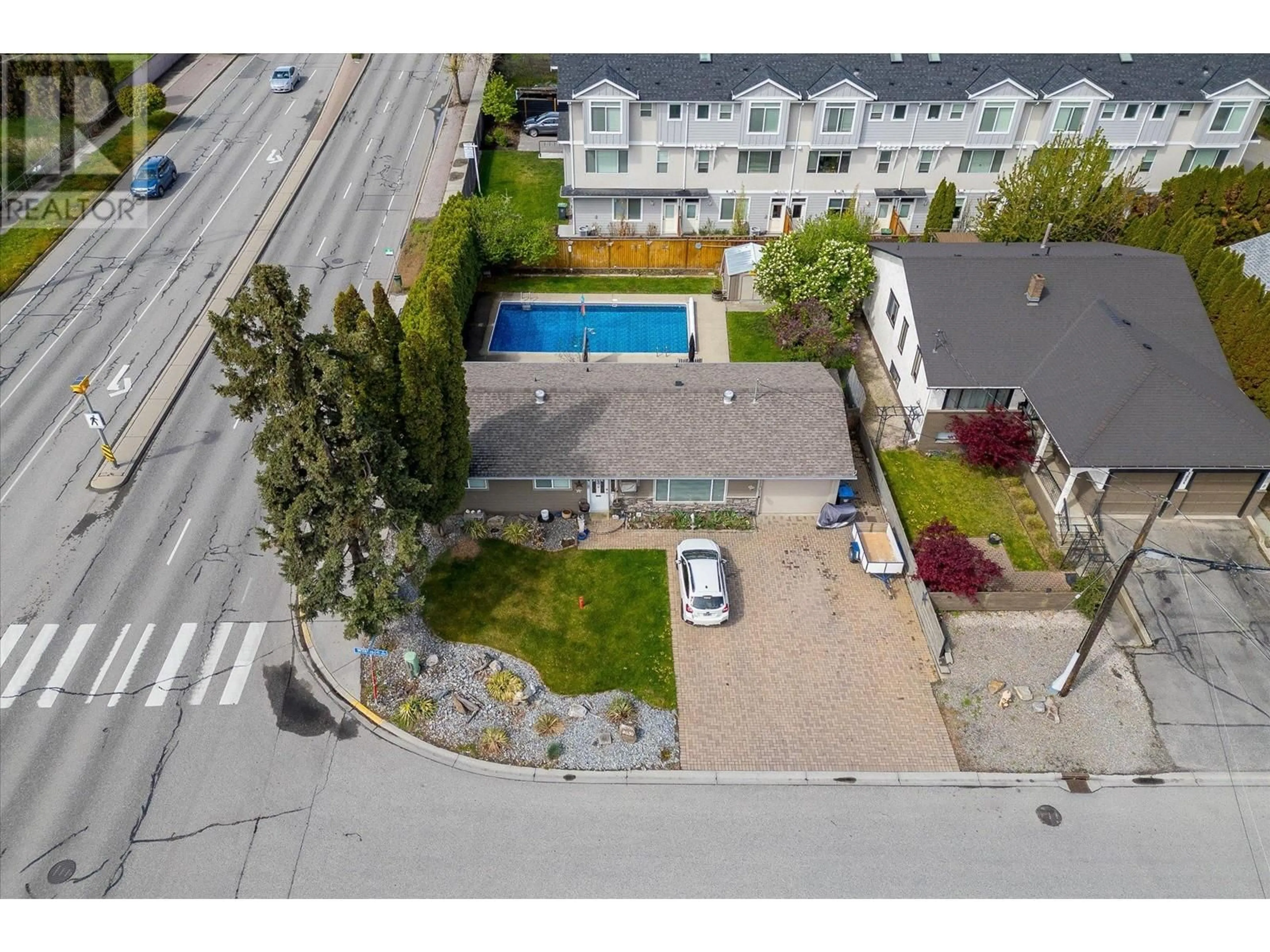 A pic from exterior of the house or condo, the fenced backyard for 2030 Wilkinson Street, Kelowna British Columbia V1Y3Z8