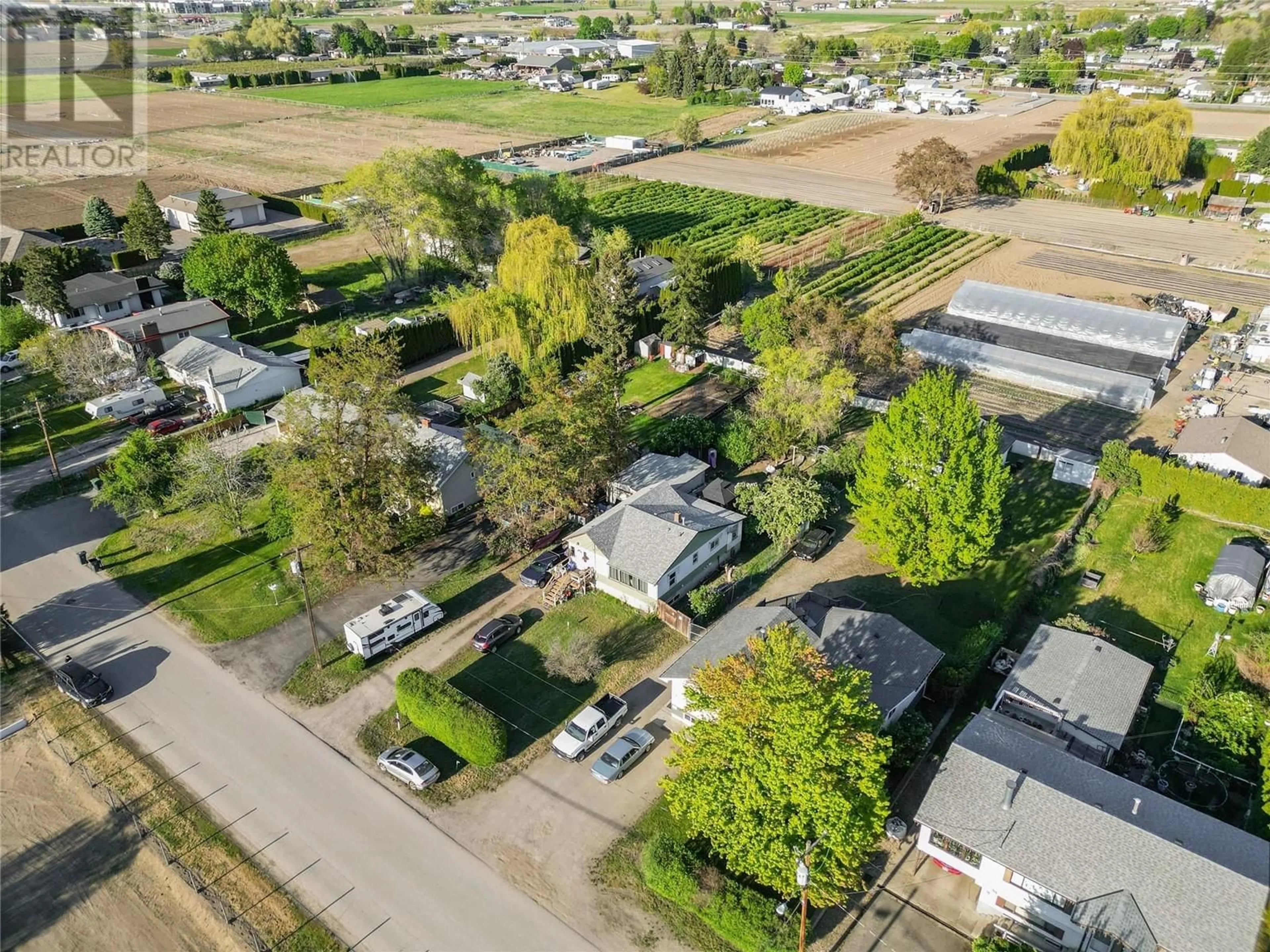 Frontside or backside of a home, the fenced backyard for 1525 STAFFORD Road, Kelowna British Columbia V1X5A4