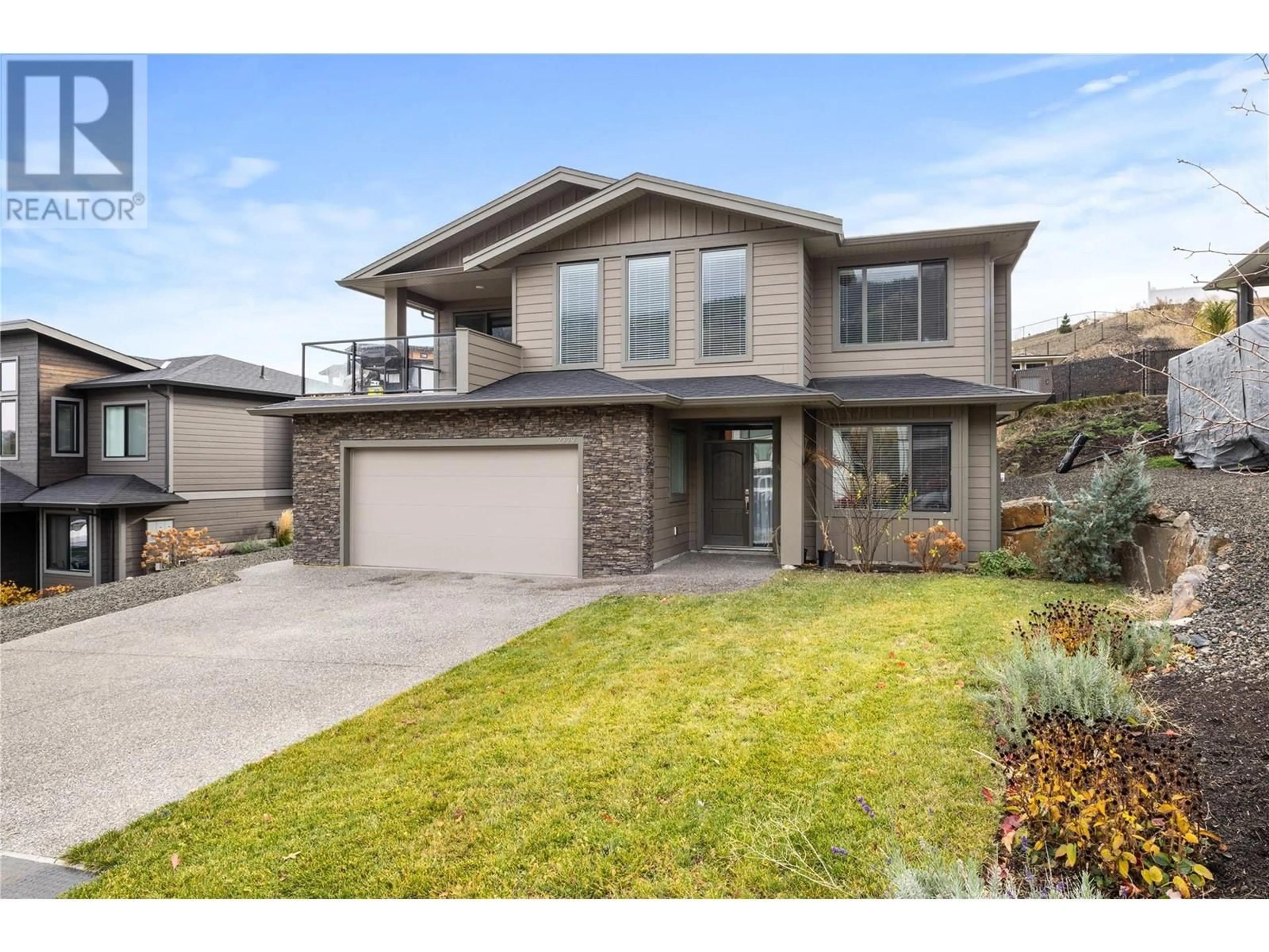 Frontside or backside of a home, the street view for 2779 Canyon Crest Drive, West Kelowna British Columbia V4T3N3