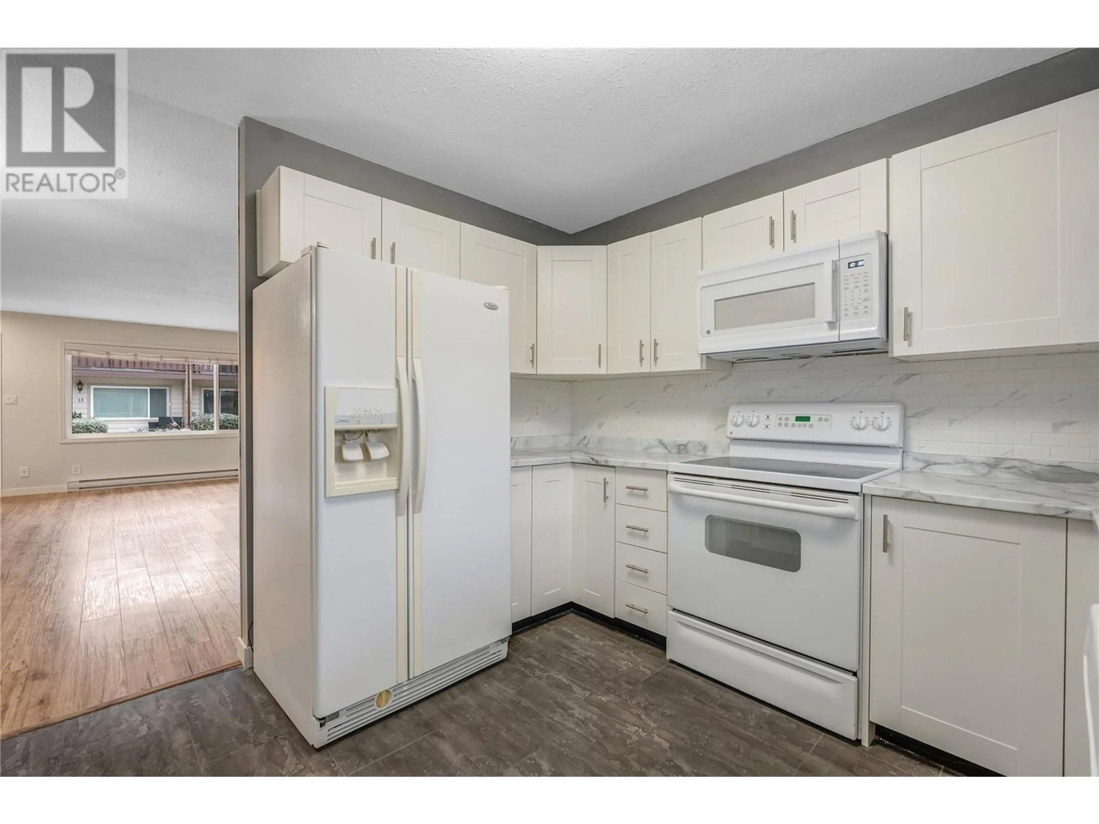 Standard kitchen, wood floors, cottage for 13707 Dickson Avenue Unit# 5, Summerland British Columbia V0H1Z0