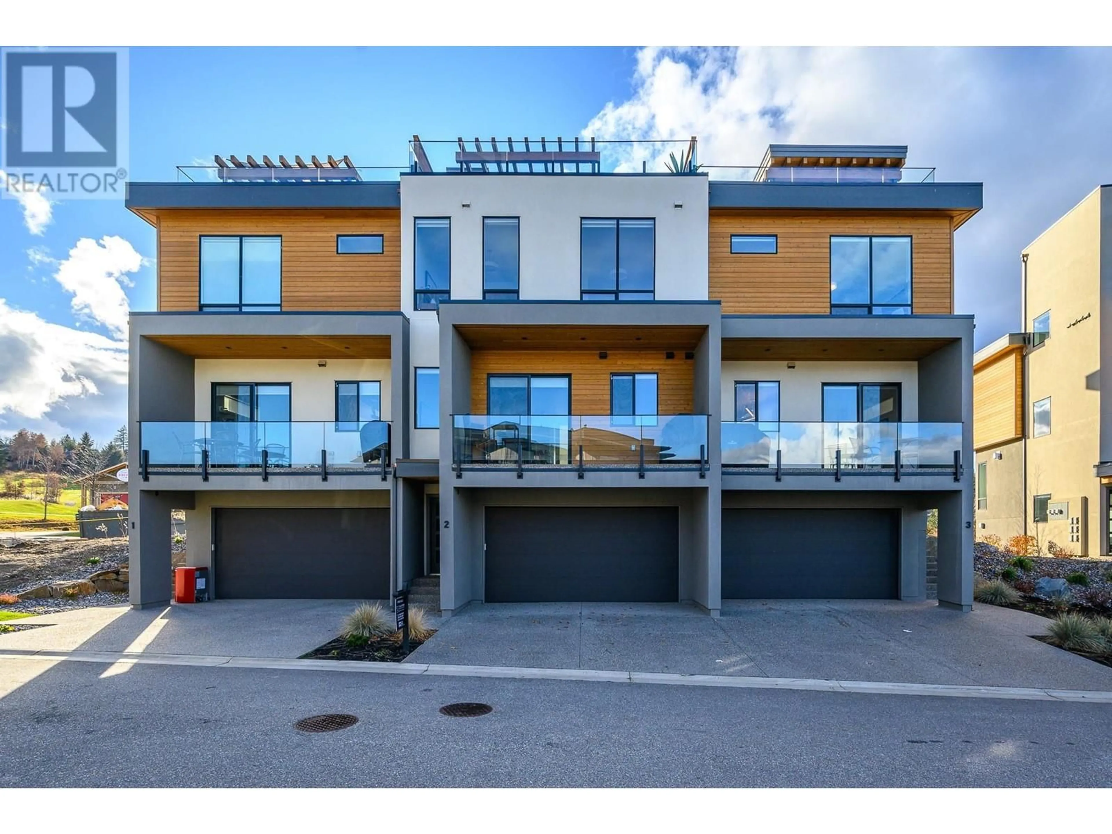 A pic from outside/outdoor area/front of a property/back of a property/a pic from drone, street for 3 - 105 PREDATOR RIDGE DRIVE, Vernon British Columbia V1H0A5