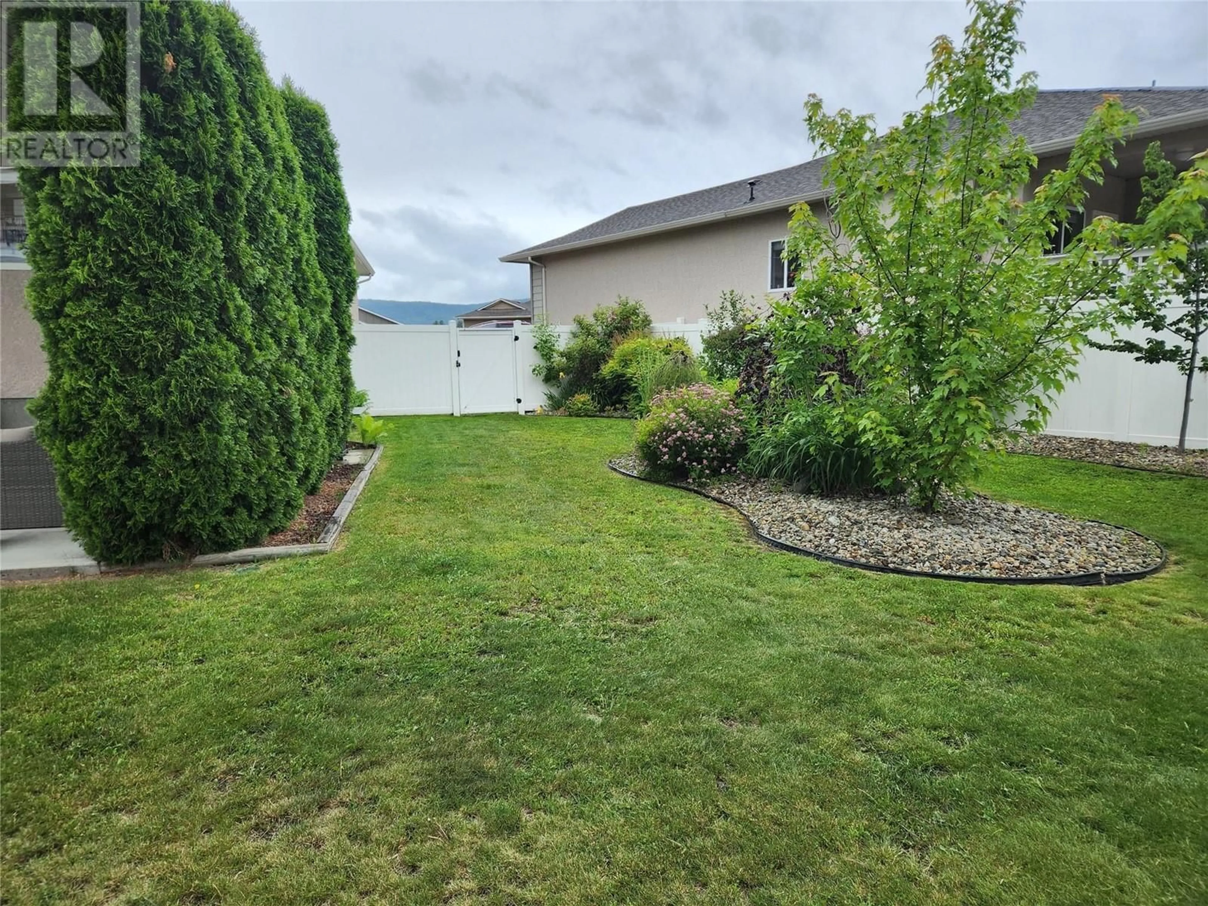 Patio, the fenced backyard for 2160 BRYCEN Place, Grand Forks British Columbia V0H1H0