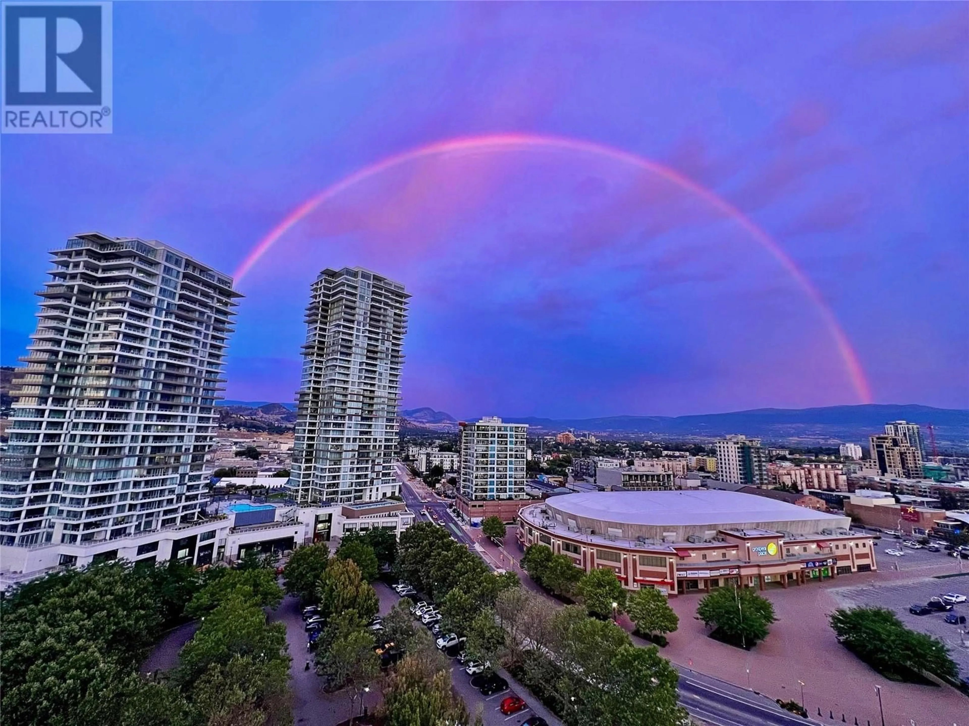 A pic from exterior of the house or condo, the view of city buildings for 1160 Sunset Drive Unit# 1702, Kelowna British Columbia V1Y7P9