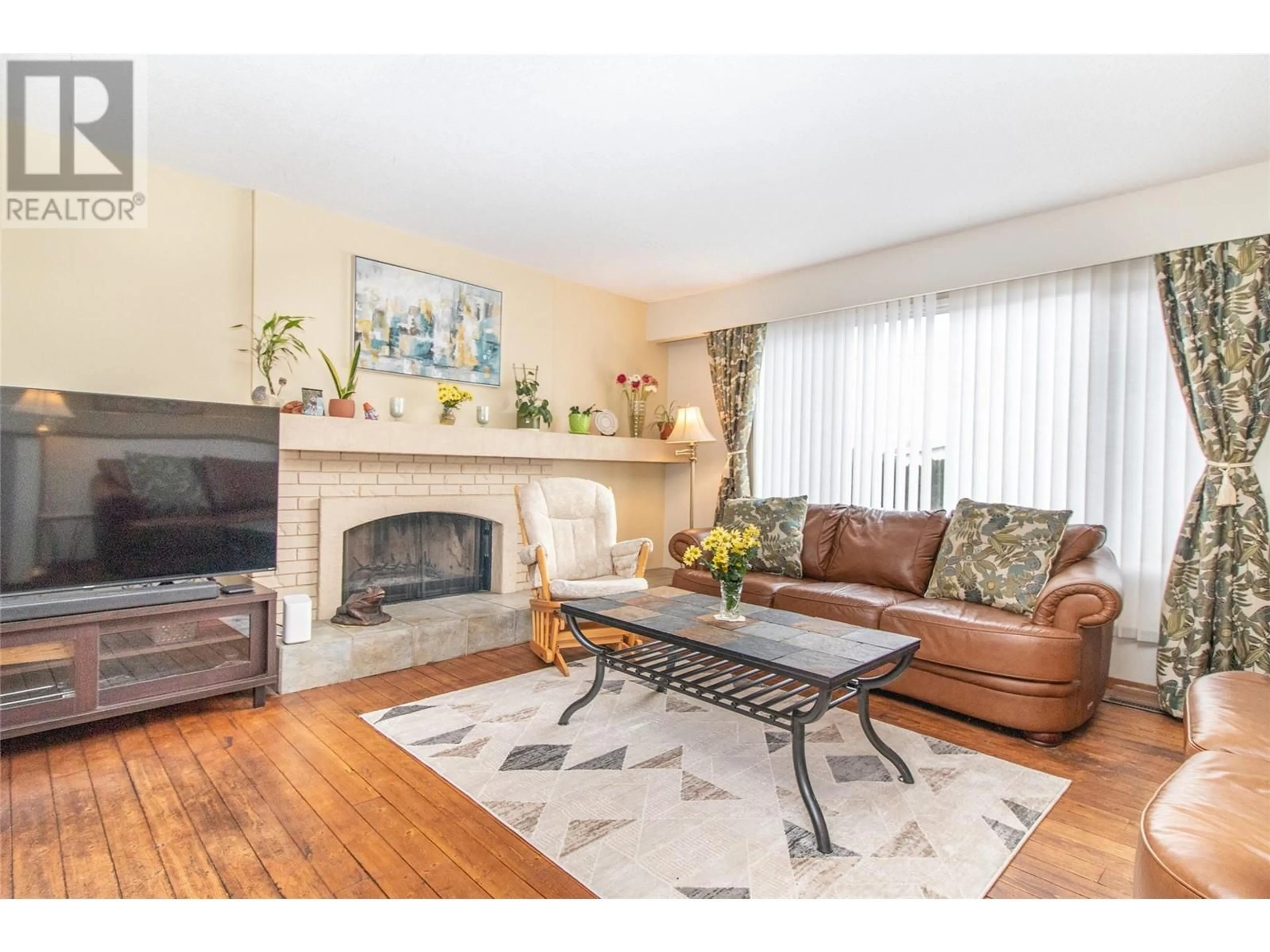 Living room, wood floors for 4306 Gordon Drive, Kelowna British Columbia V1W2L3