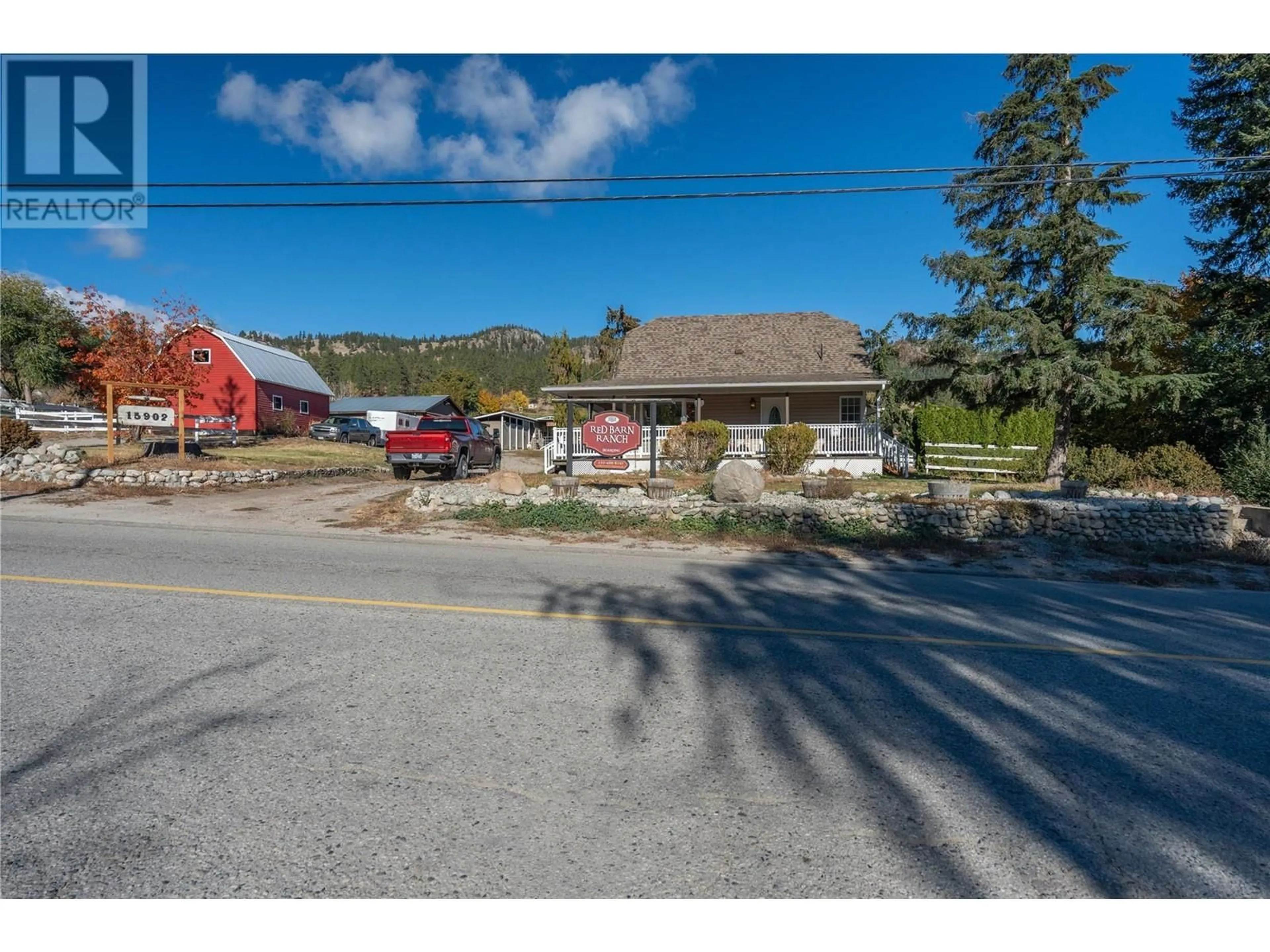 A pic from exterior of the house or condo, the street view for 15902 Prairie Valley Road, Summerland British Columbia V0H1Z0