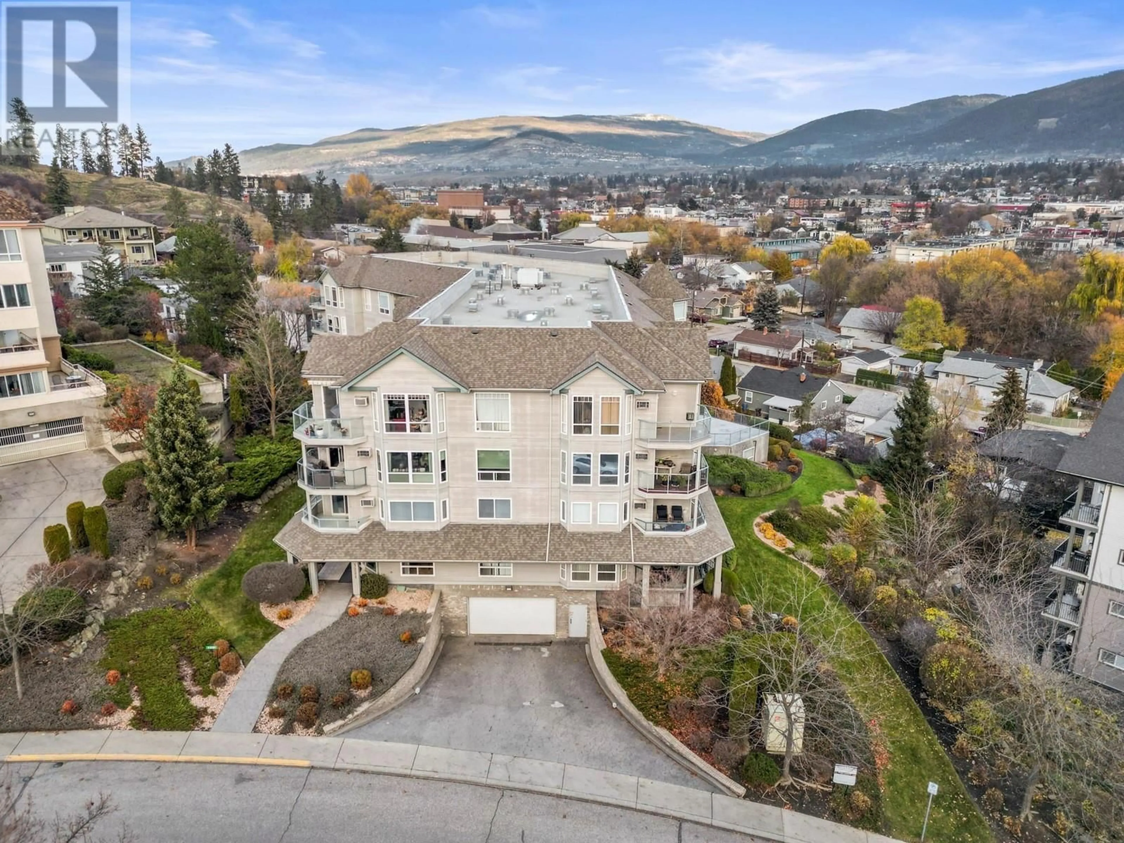 A pic from exterior of the house or condo, the street view for 3221 Centennial Drive Unit# 210, Vernon British Columbia V1T2T8