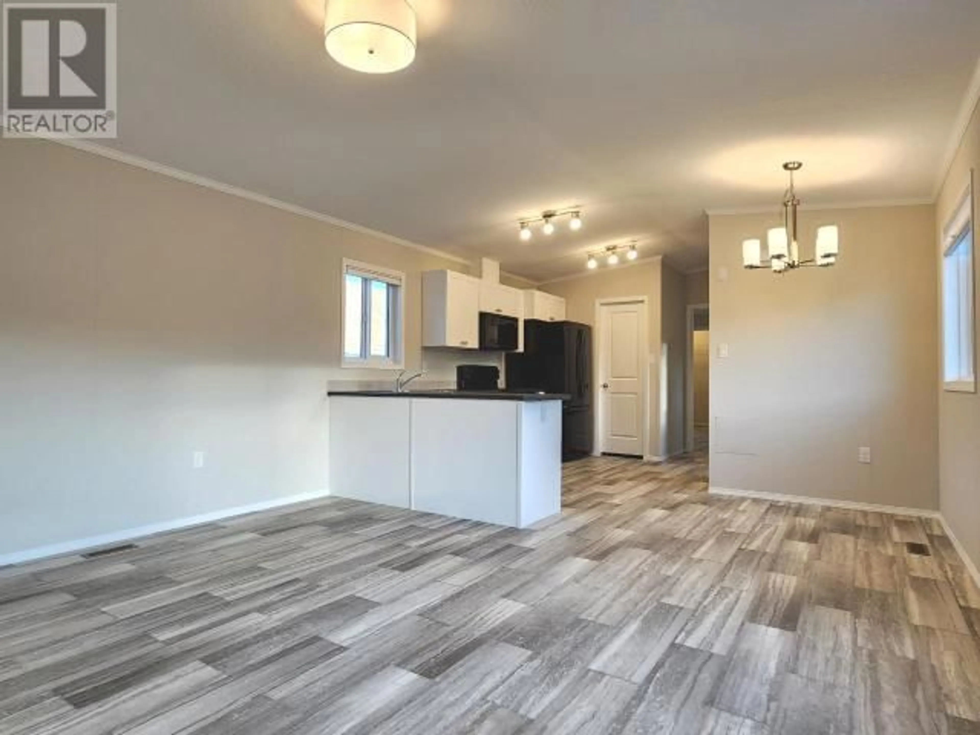 Open concept kitchen, wood/laminate floor for 9 - 1620 STAGE ROAD, Cache Creek British Columbia V0K1H0