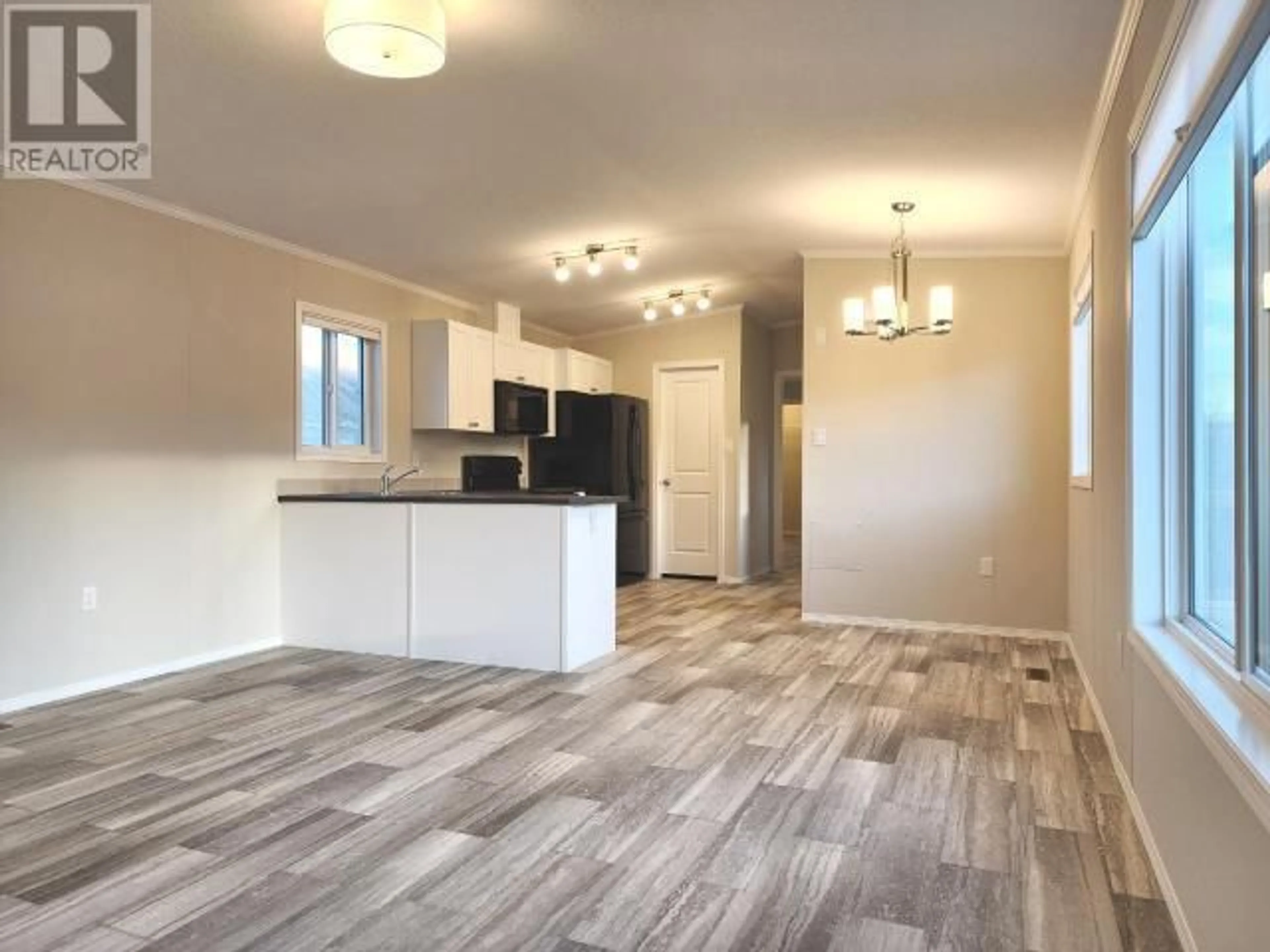 Open concept kitchen, wood/laminate floor for 9 - 1620 STAGE ROAD, Cache Creek British Columbia V0K1H0