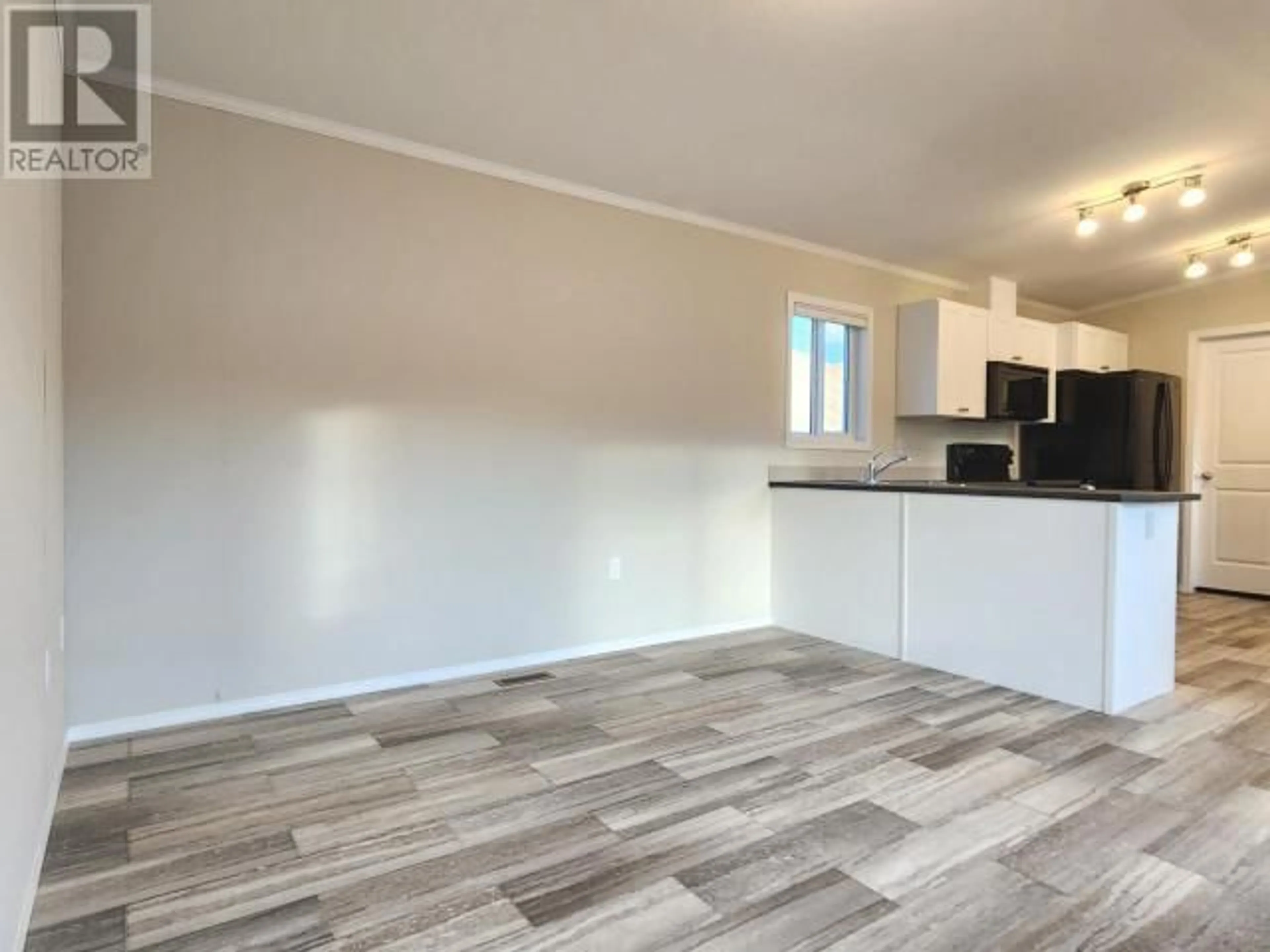 A pic of a room, wood floors for 1620 STAGE Road Unit# 9, Cache Creek British Columbia V0K1H0