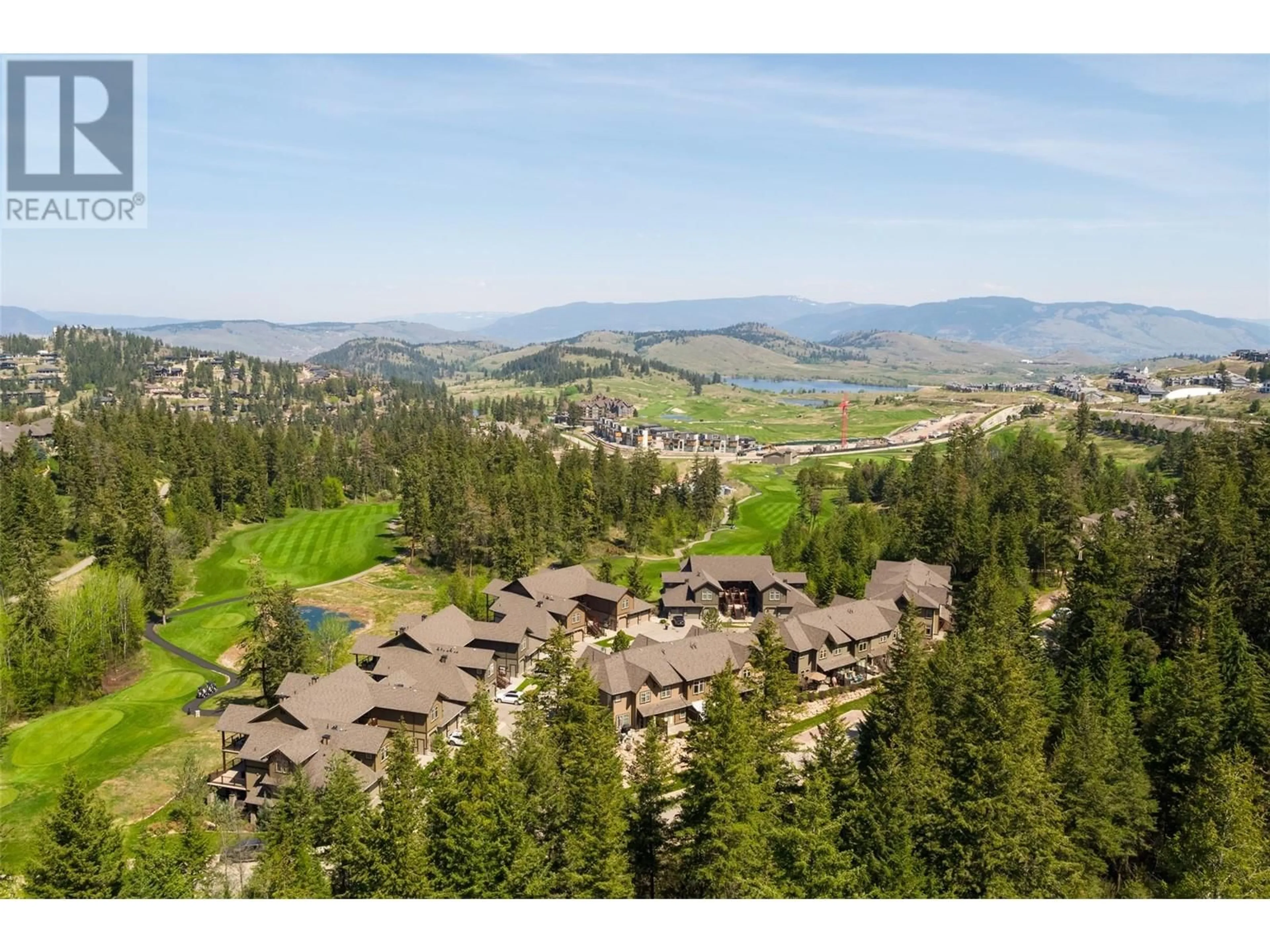 A pic from outside/outdoor area/front of a property/back of a property/a pic from drone, mountain view for 333 Longspoon Drive Unit# 31, Vernon British Columbia V1H2L1