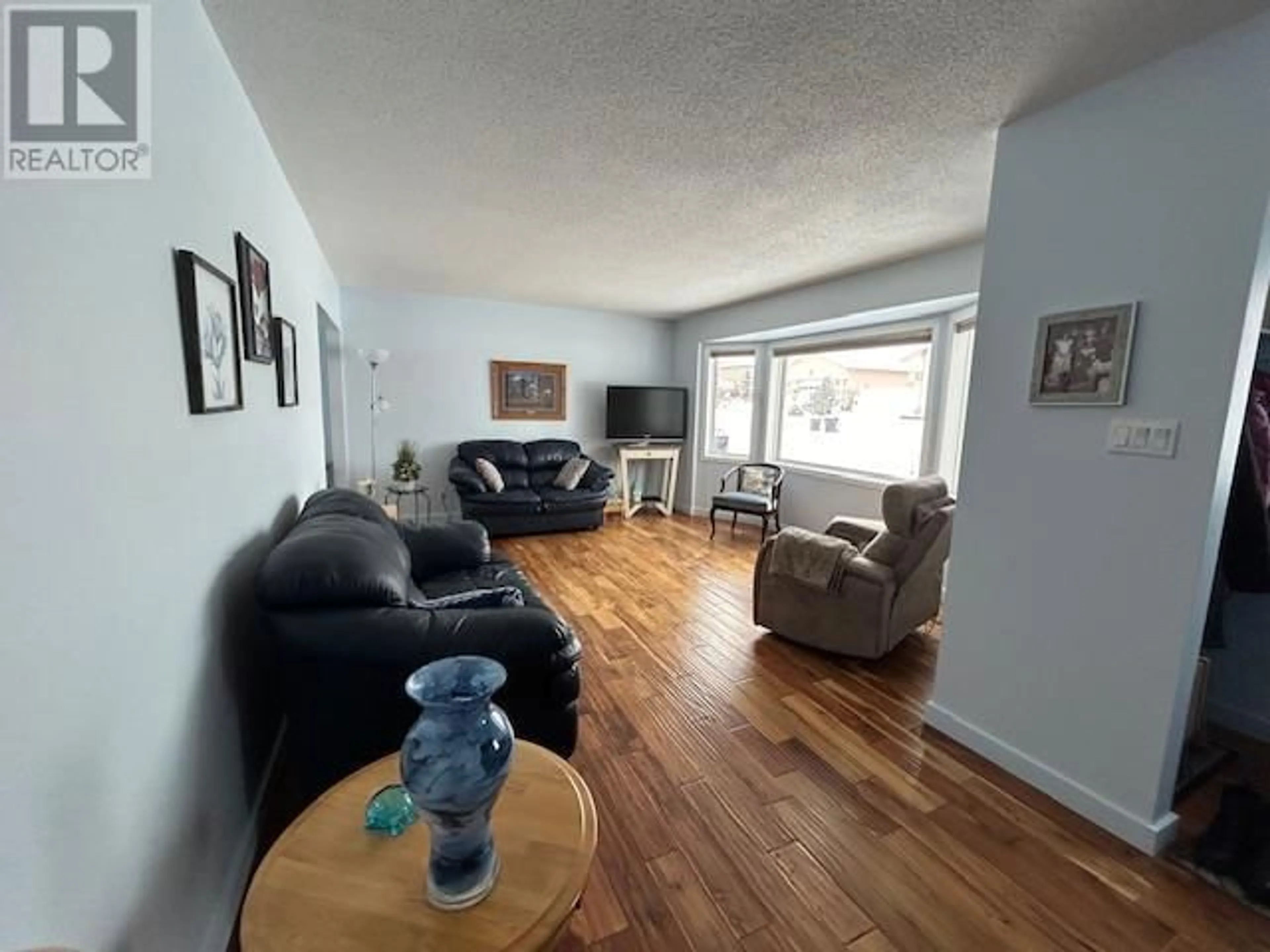 A pic of a room, wood floors for 1321 92 Avenue, Dawson Creek British Columbia V1G1C4