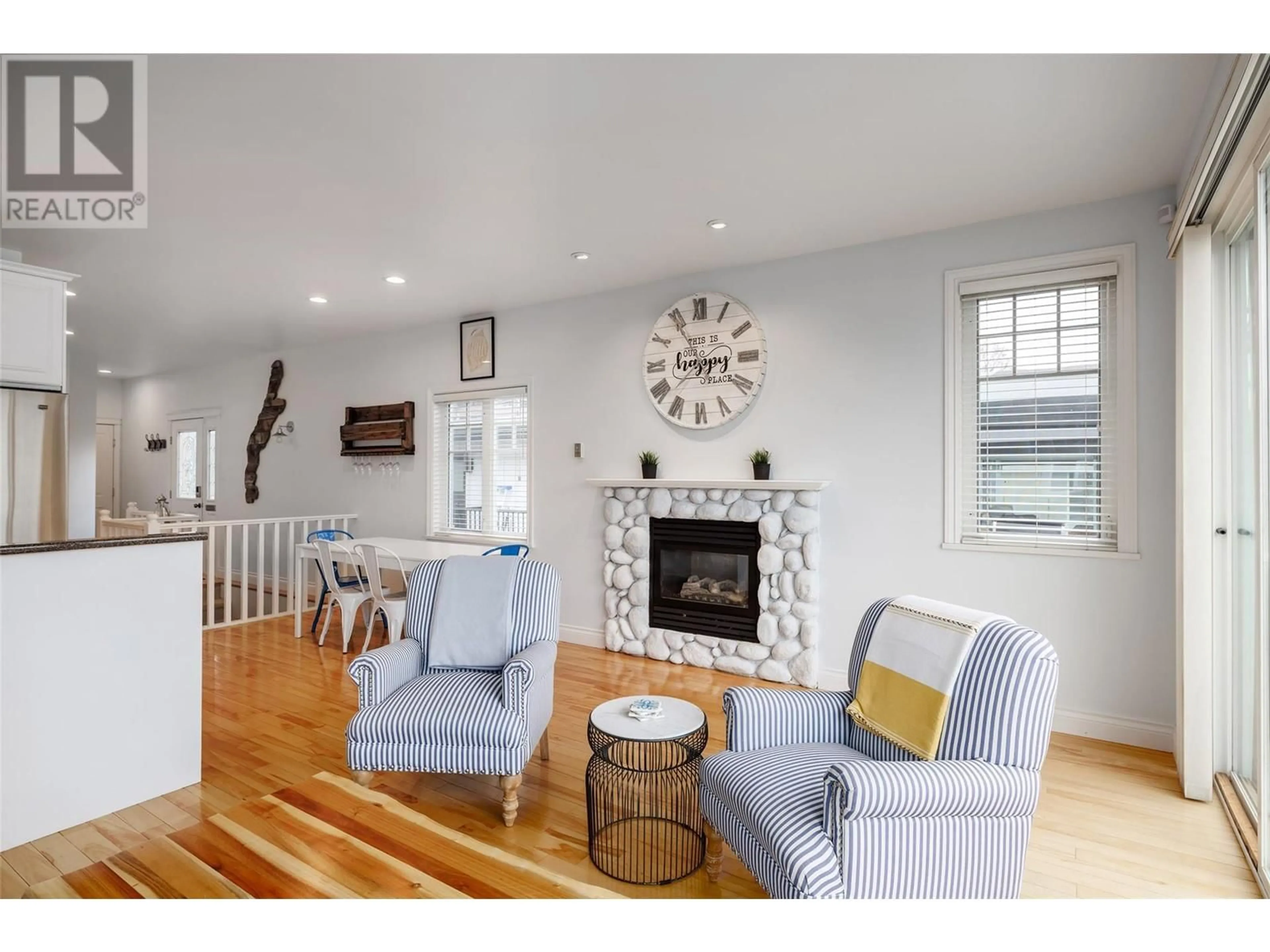 Living room with furniture, wood/laminate floor for 13420 WESTKAL ROAD, Coldstream British Columbia V1B1Y4