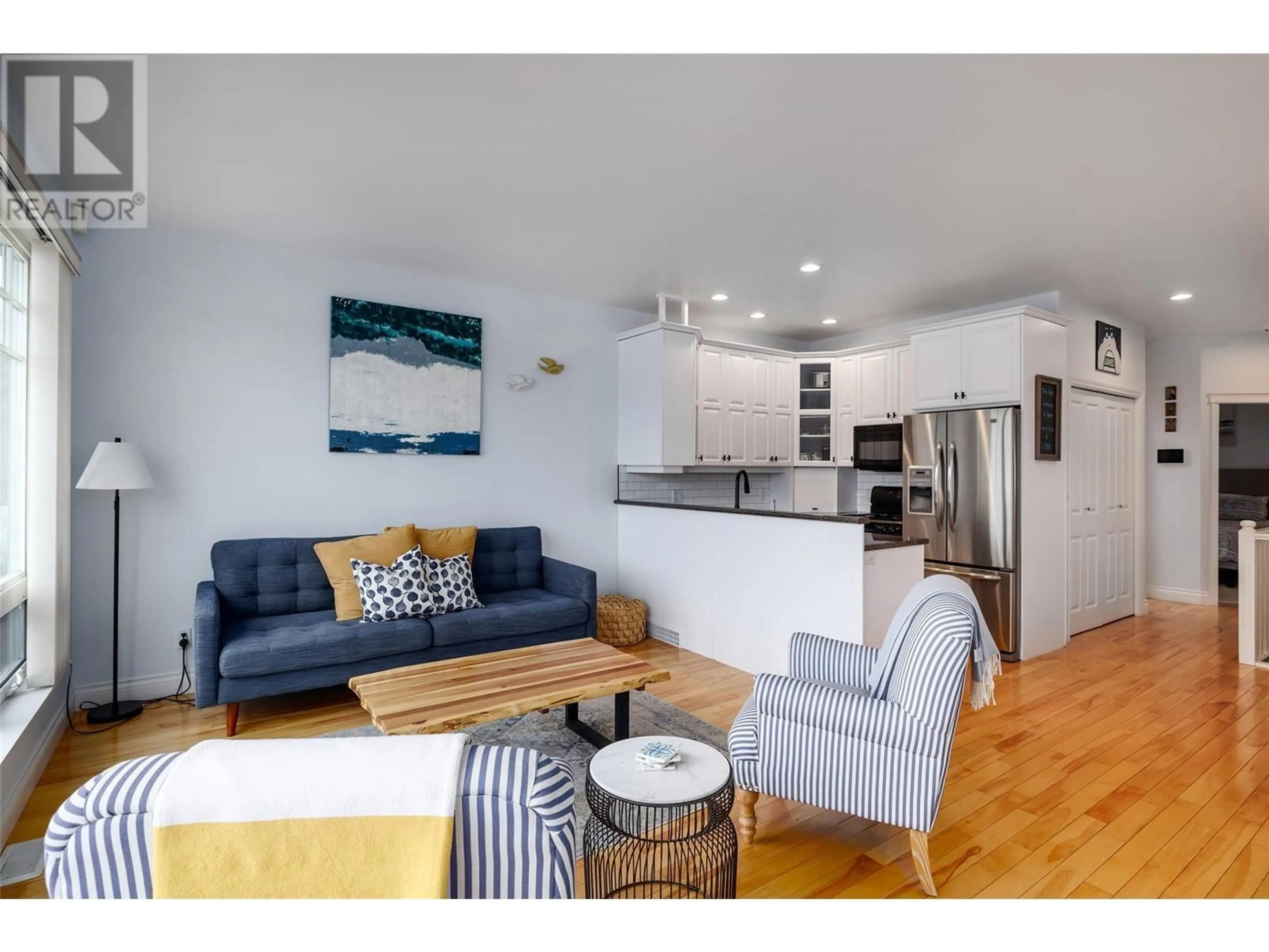 Living room with furniture, wood/laminate floor for 13420 WESTKAL ROAD, Coldstream British Columbia V1B1Y4