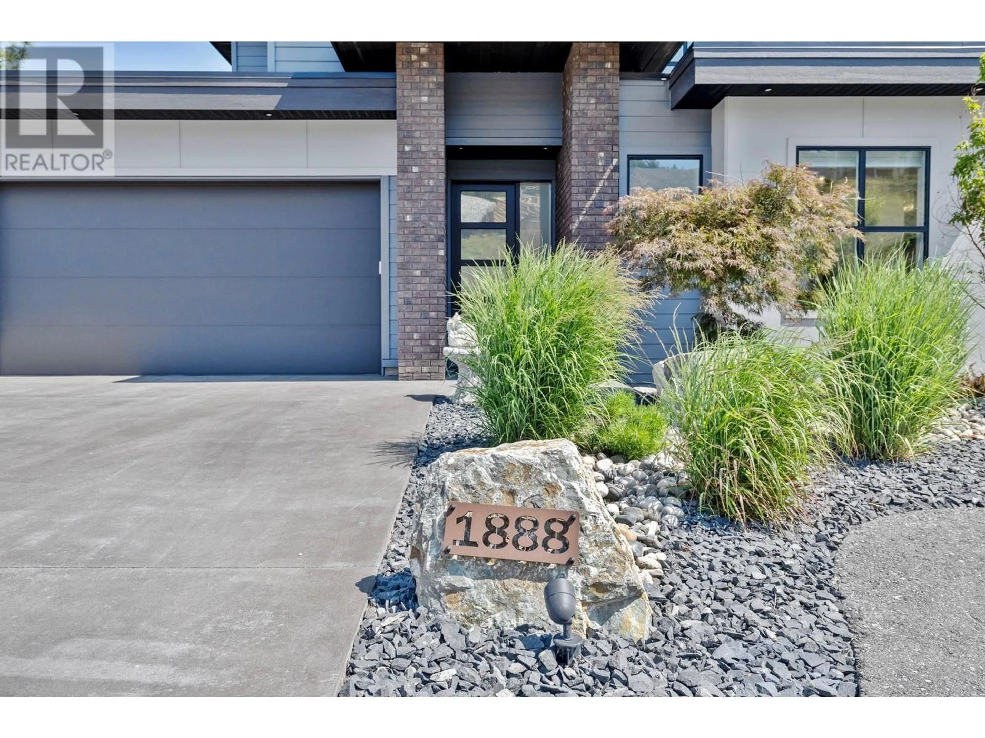 Home with brick exterior material for 1888 Northern Flicker Court, Kelowna British Columbia V1V0G3