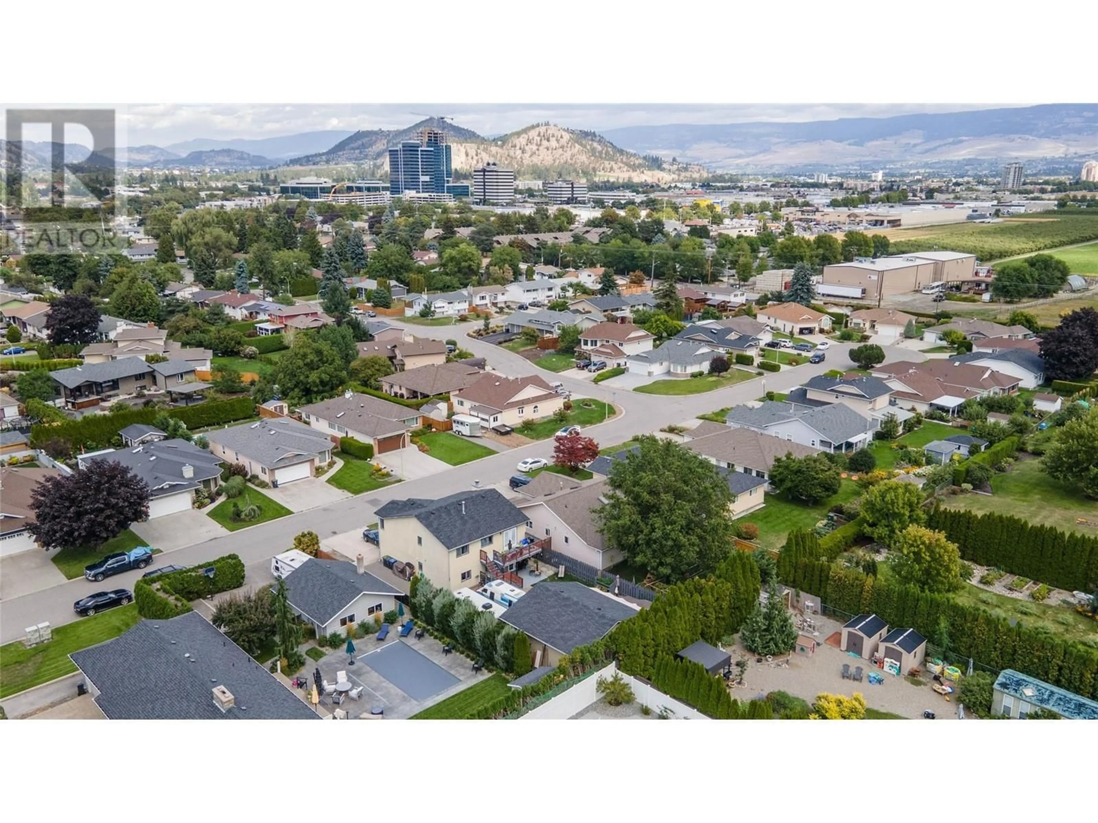 A pic from outside/outdoor area/front of a property/back of a property/a pic from drone, mountain view for 1415 NELSON PLACE, Kelowna British Columbia V1Y9H4