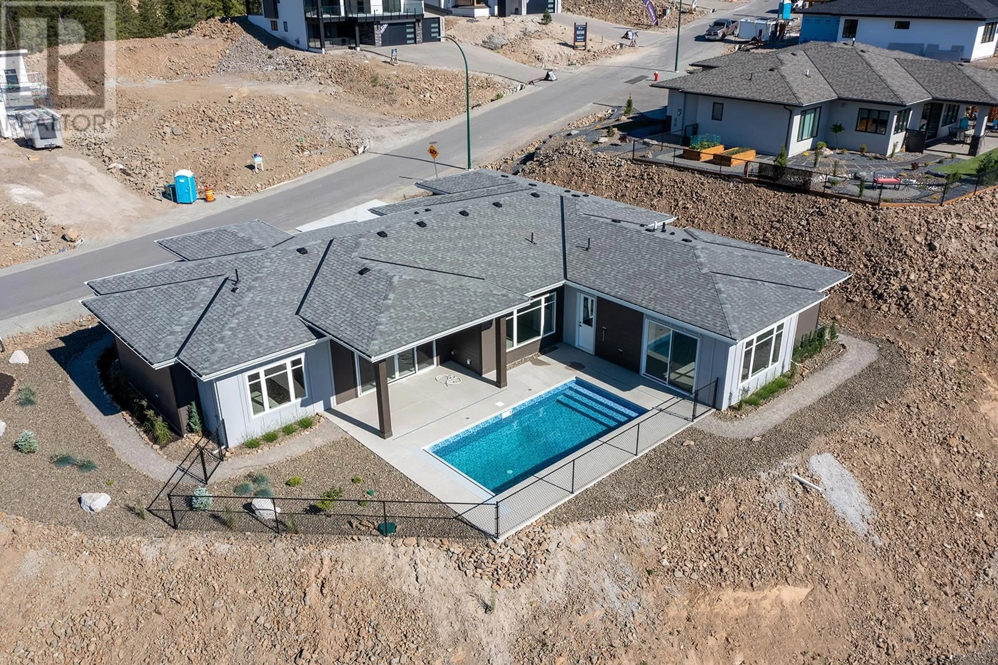 Frontside or backside of a home, the fenced backyard for 18661 Sanborn Street, Summerland British Columbia V0H1Z3