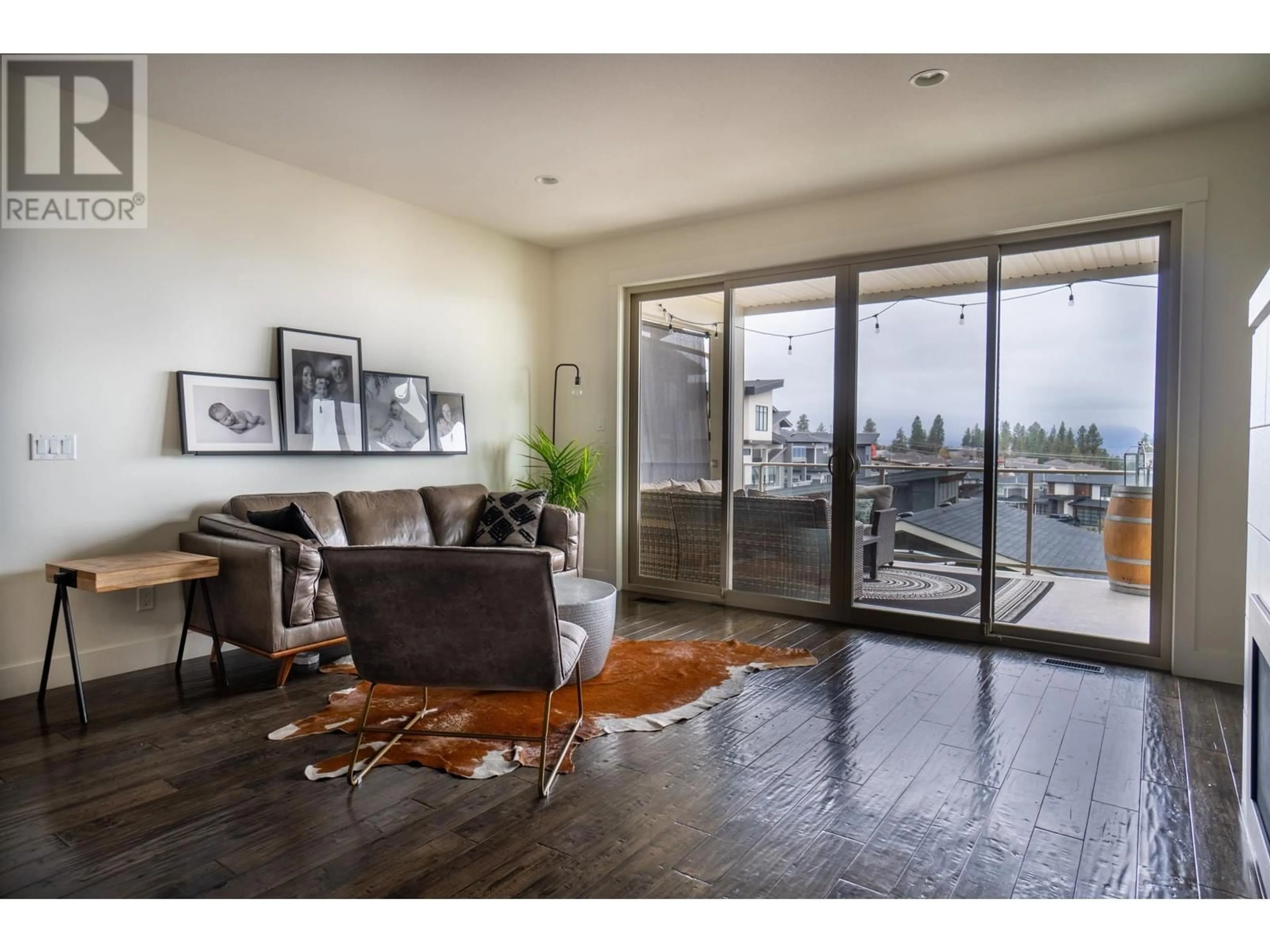 Living room, wood floors for 1172 Frost Road, Kelowna British Columbia V1W5M1