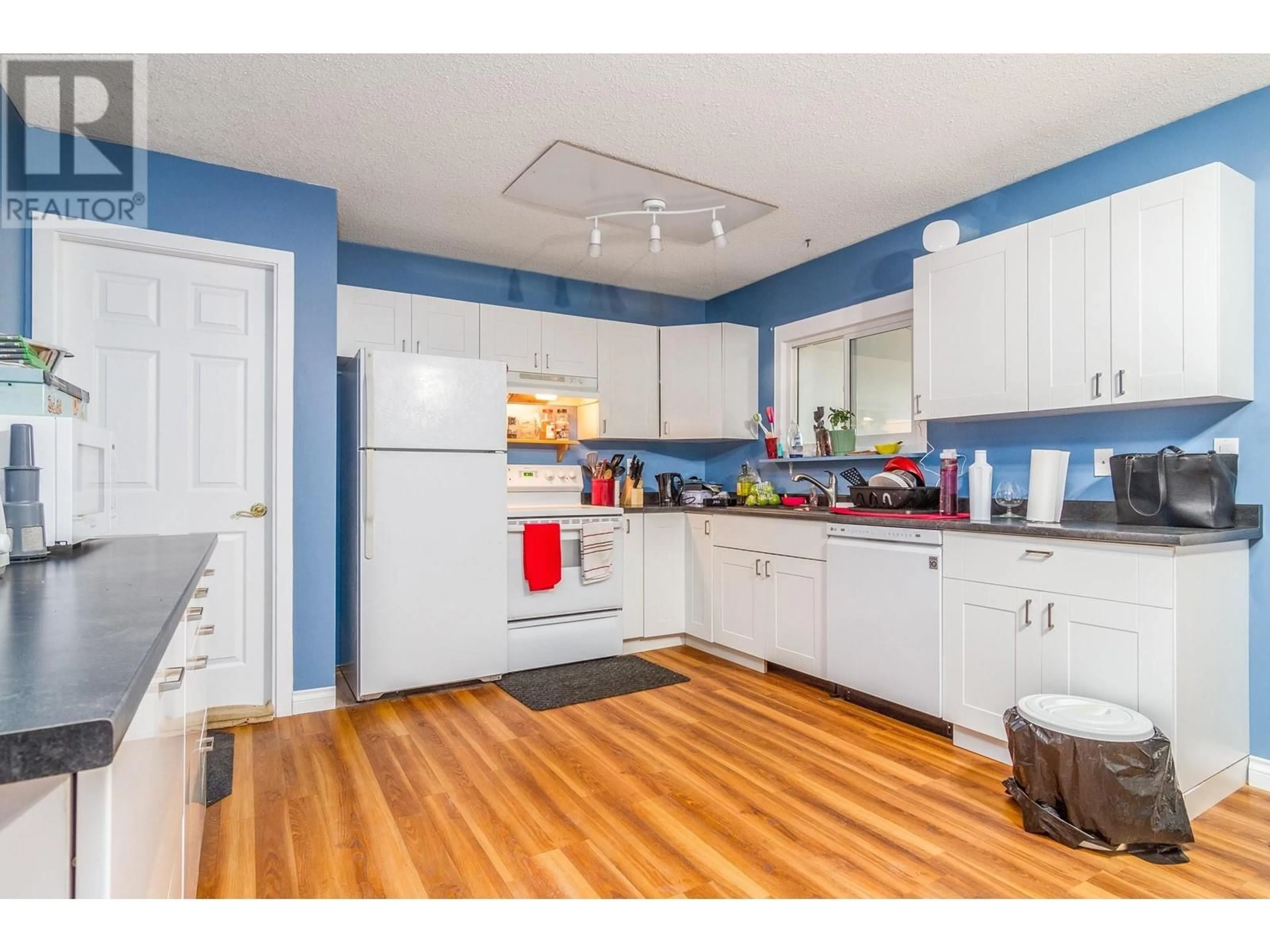 Kitchen, wood floors, cottage for 3072 Springfield Road, Kelowna British Columbia V1X4M4