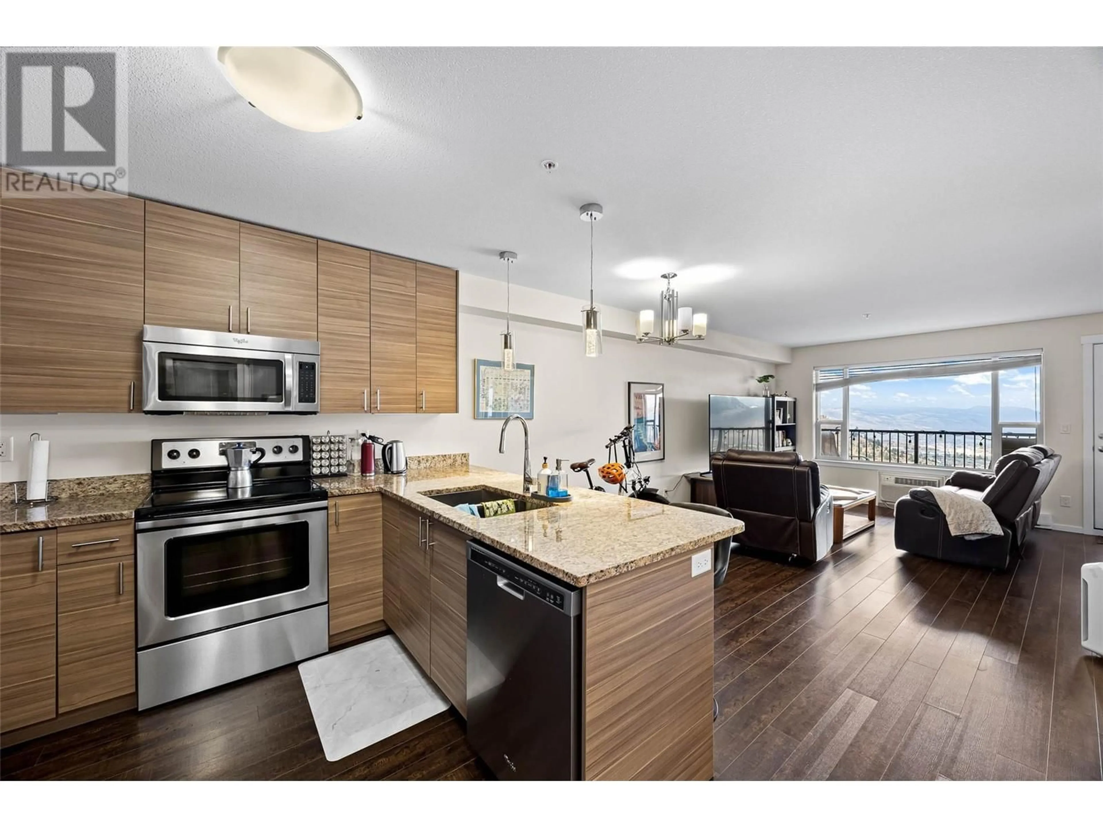 Open concept kitchen, wood/laminate floor for 306 - 1200 HARRISON PLACE, Kamloops British Columbia V1S1M1