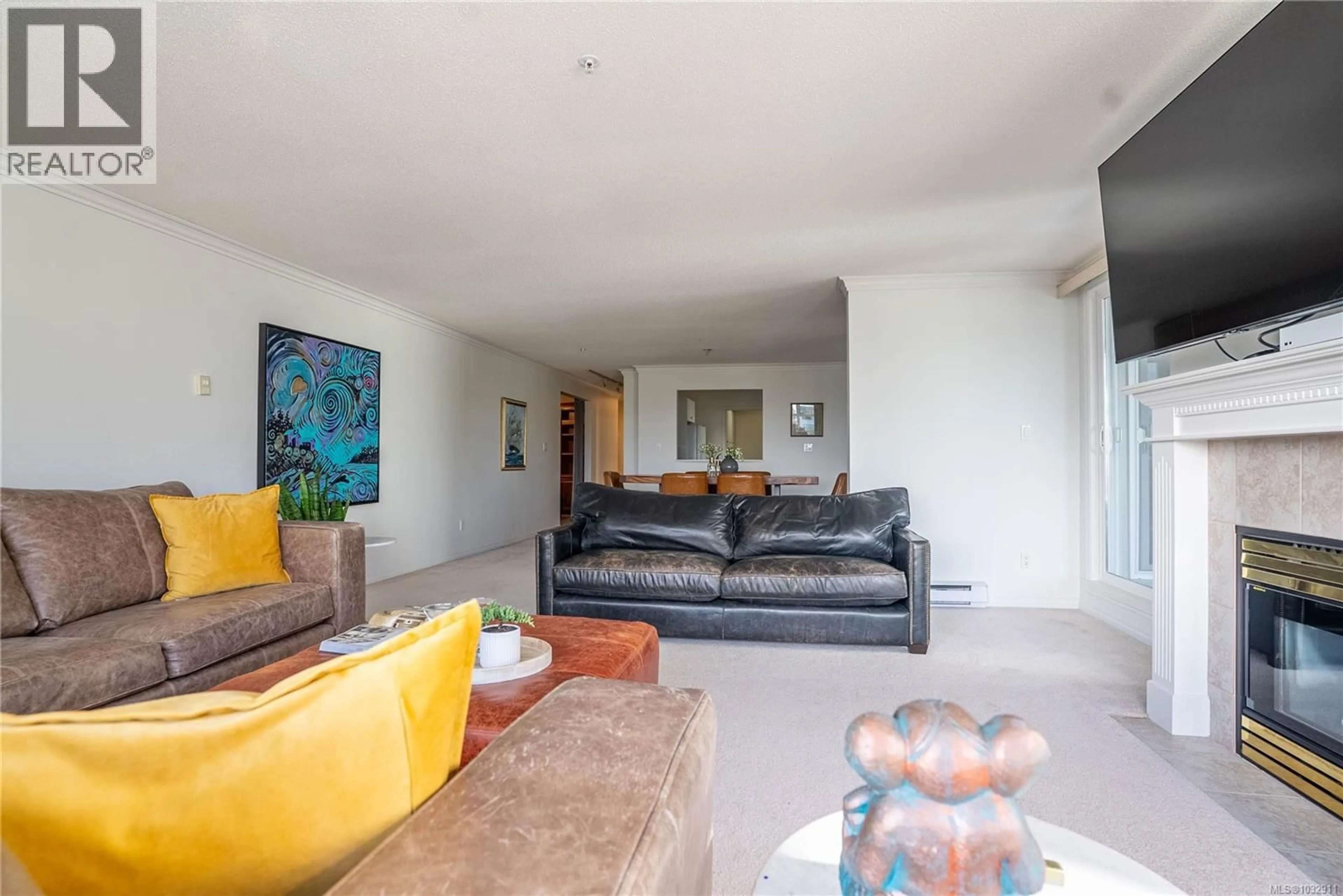 Living room with furniture, cement floor for 306 - 5110 CORDOVA BAY ROAD, Saanich British Columbia V8Y2K5