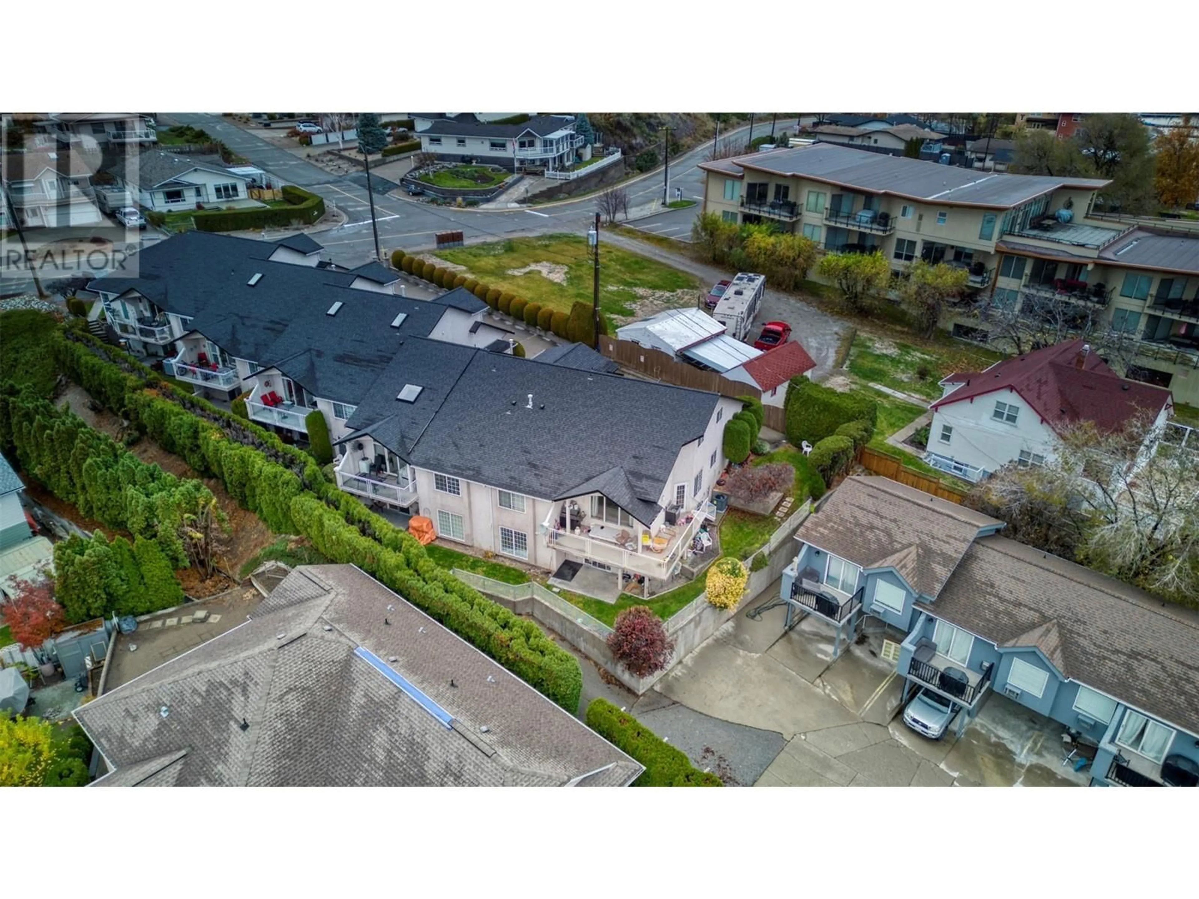 A pic from outside/outdoor area/front of a property/back of a property/a pic from drone, street for 1 - 4805 OLEANDER DRIVE, Osoyoos British Columbia V0H1V1