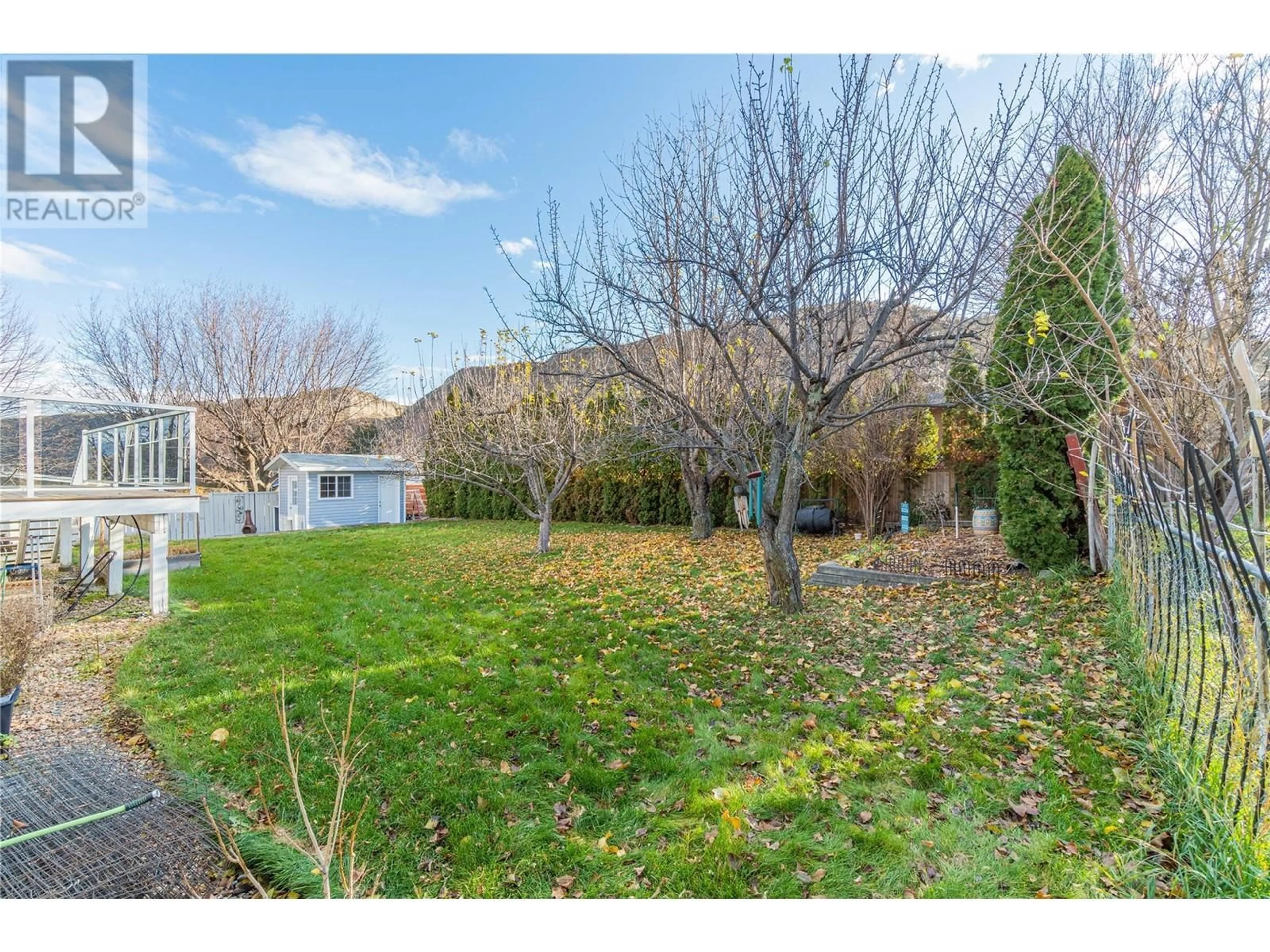 A pic from exterior of the house or condo, the fenced backyard for 1937 CARDINAL Drive, Kamloops British Columbia V2C4H5