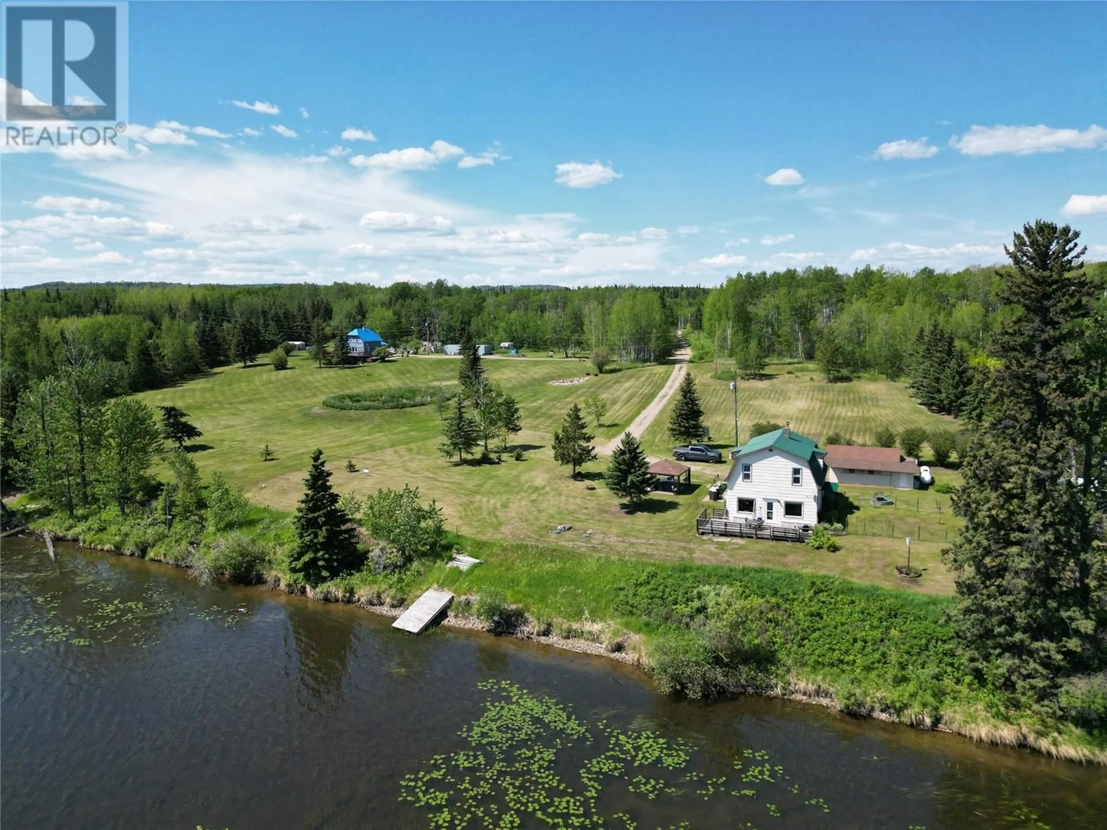 A pic from outside/outdoor area/front of a property/back of a property/a pic from drone, water/lake/river/ocean view for 16020 TUPPER VILLAGE WAY, Dawson Creek British Columbia V0C0B7