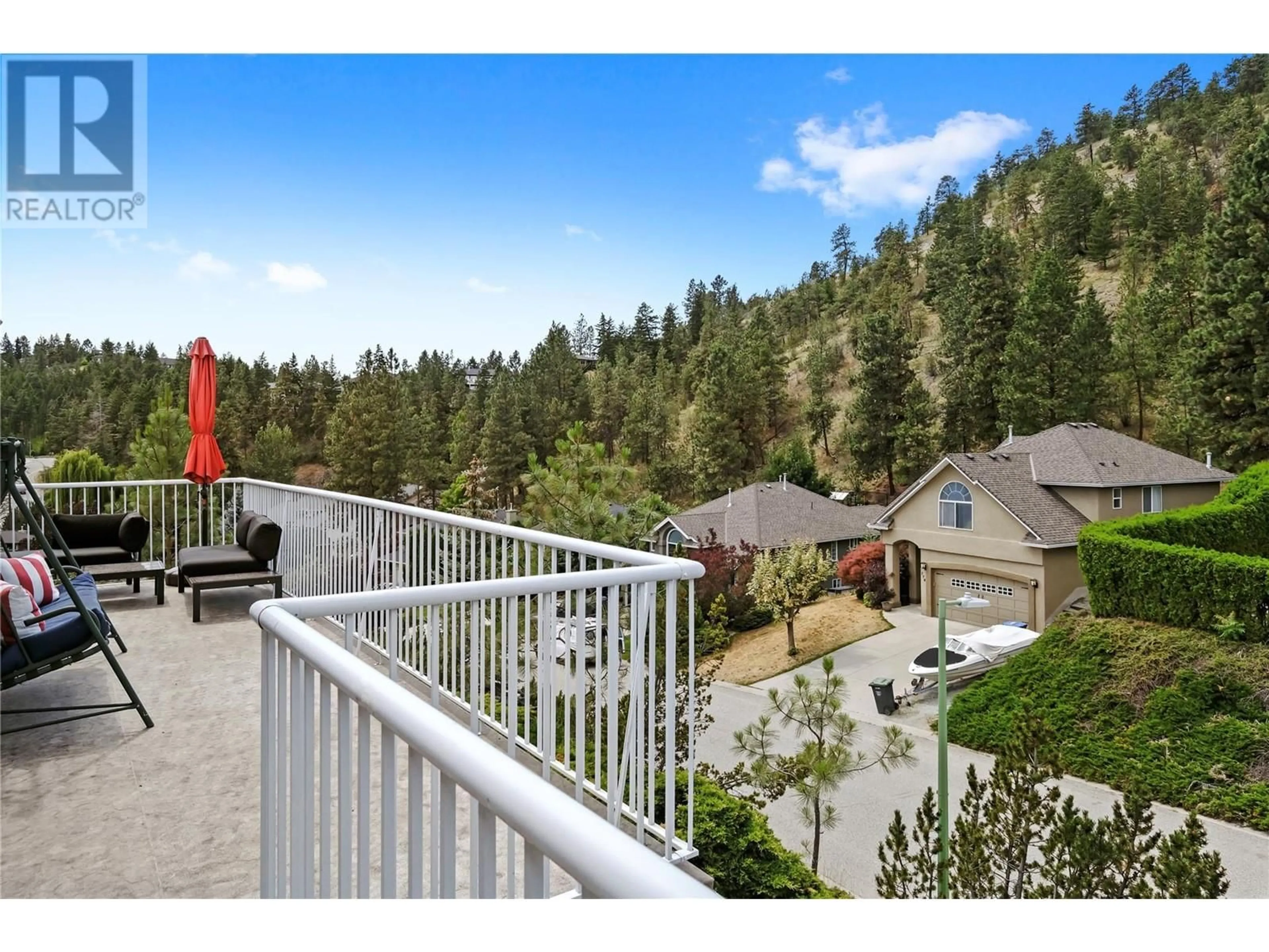 A pic from outside/outdoor area/front of a property/back of a property/a pic from drone, forest/trees view for 773 Siwash Court, Kelowna British Columbia V1V1N5