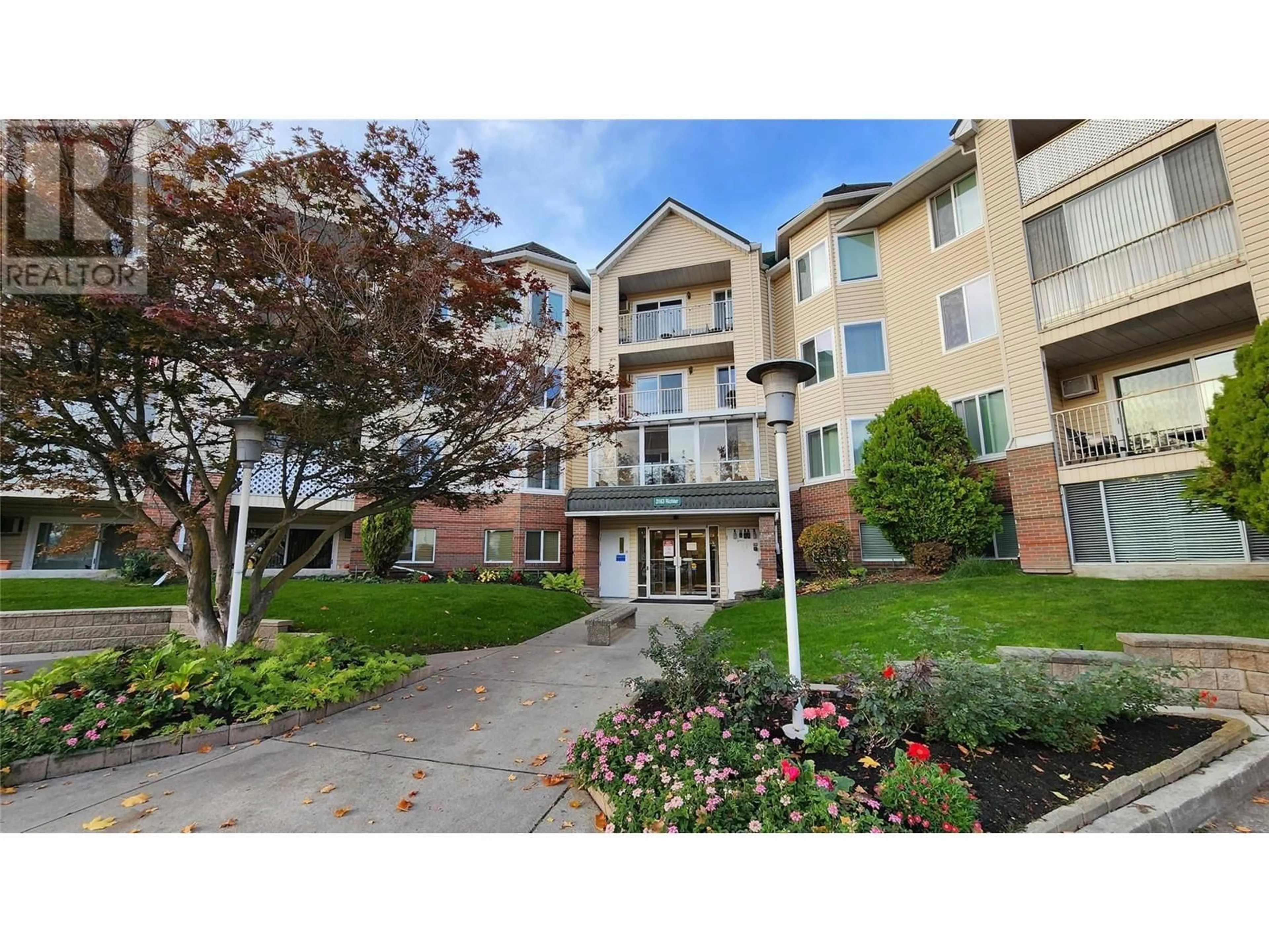 A pic from exterior of the house or condo, the street view for 3163 Richter Street Unit# 422, Kelowna British Columbia V1W3R4