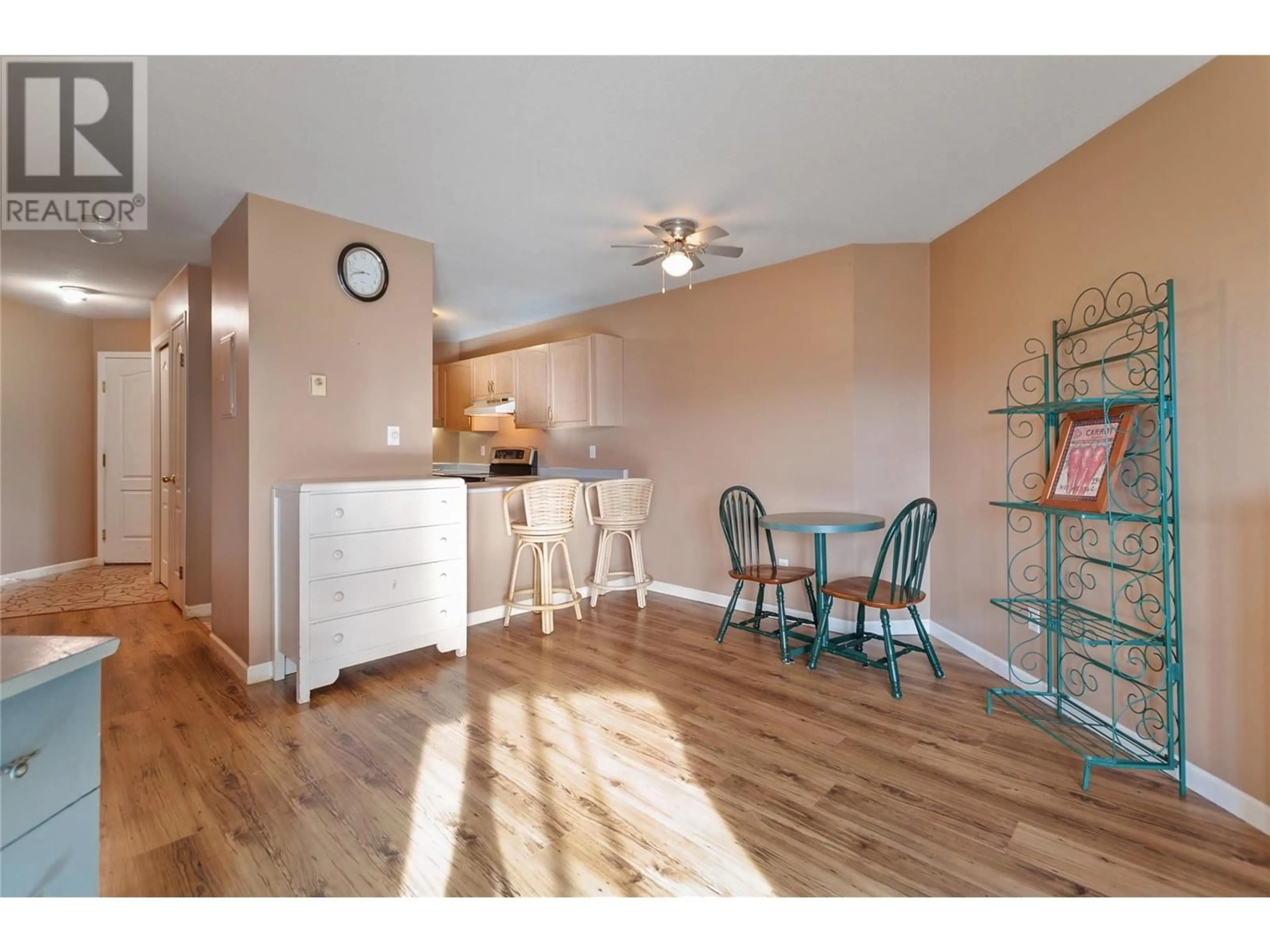 Open concept kitchen, wood/laminate floor for 3163 Richter Street Unit# 422, Kelowna British Columbia V1W3R4