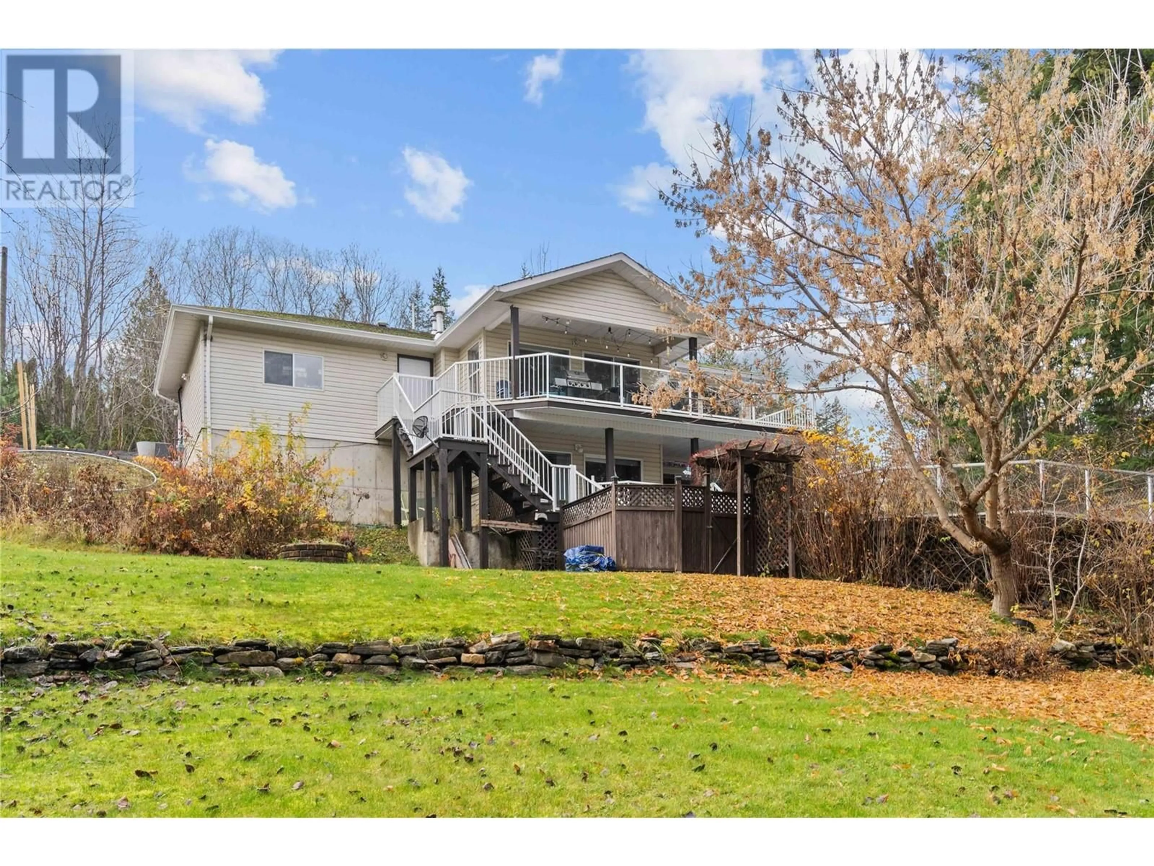 Frontside or backside of a home, the fenced backyard for 522 Caouette Road, Sorrento British Columbia V0E2W1