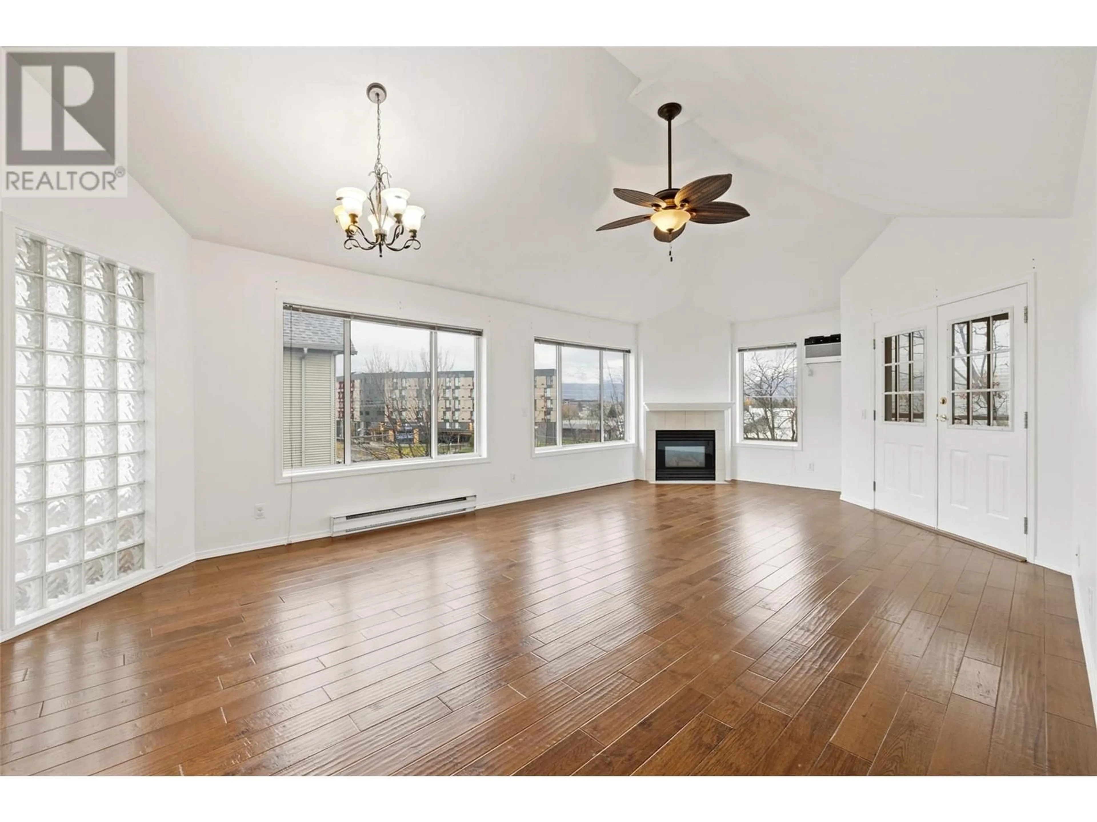 A pic of a room, wood floors for 985 KLO Road Unit# 319, Kelowna British Columbia V1Y9L2