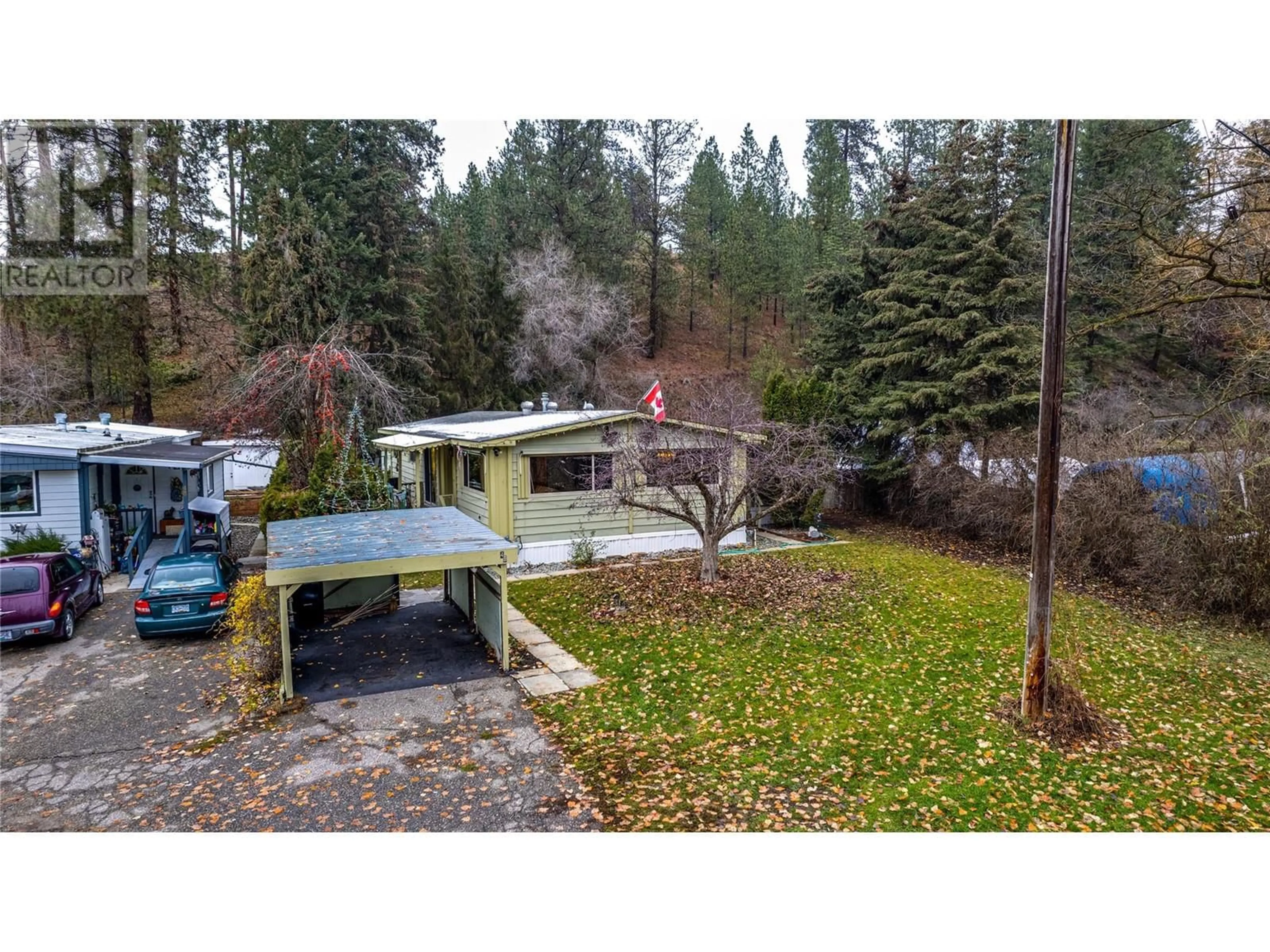 A pic from outside/outdoor area/front of a property/back of a property/a pic from drone, forest/trees view for 49 - 4701 PLEASANT VALLEY ROAD, Vernon British Columbia V1T4M7