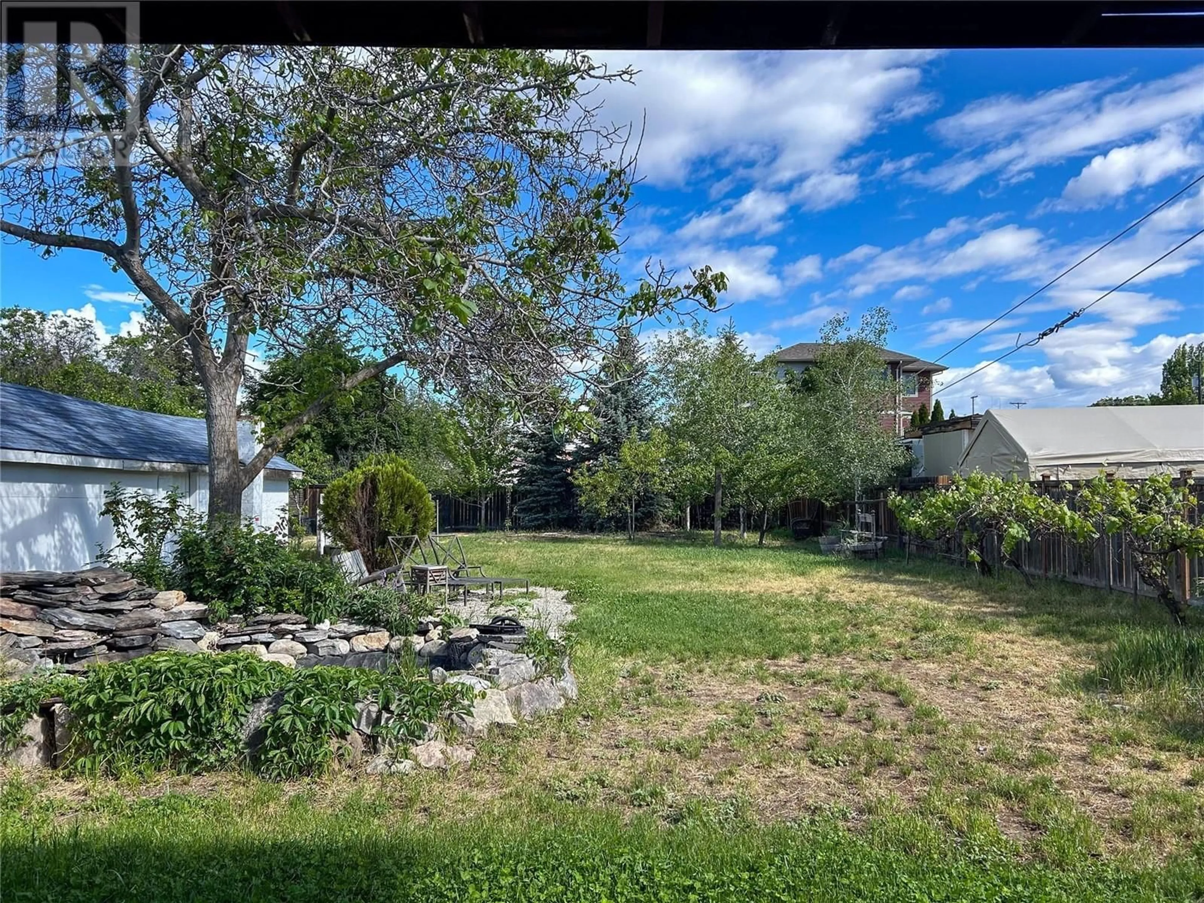 Frontside or backside of a home, the fenced backyard for 325 Nelson Avenue, Penticton British Columbia V2A2L1