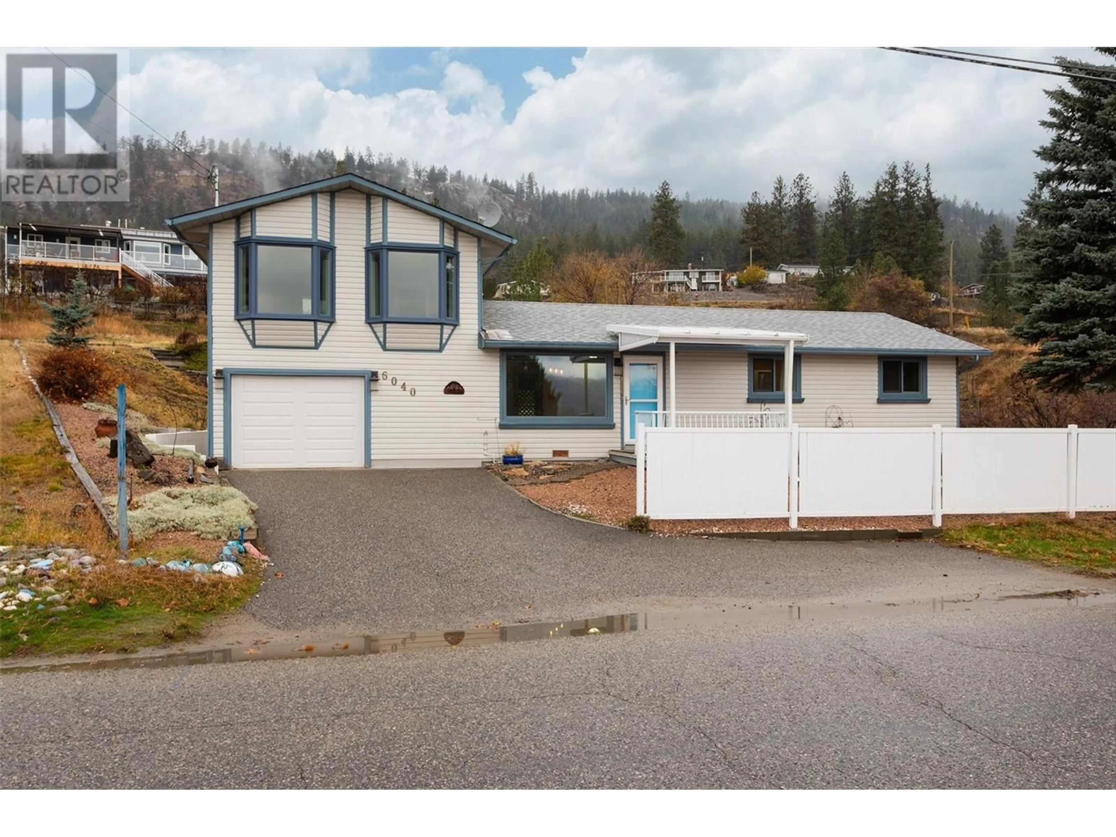 Frontside or backside of a home, the street view for 6040 Ellison Avenue, Peachland British Columbia V0H1X4