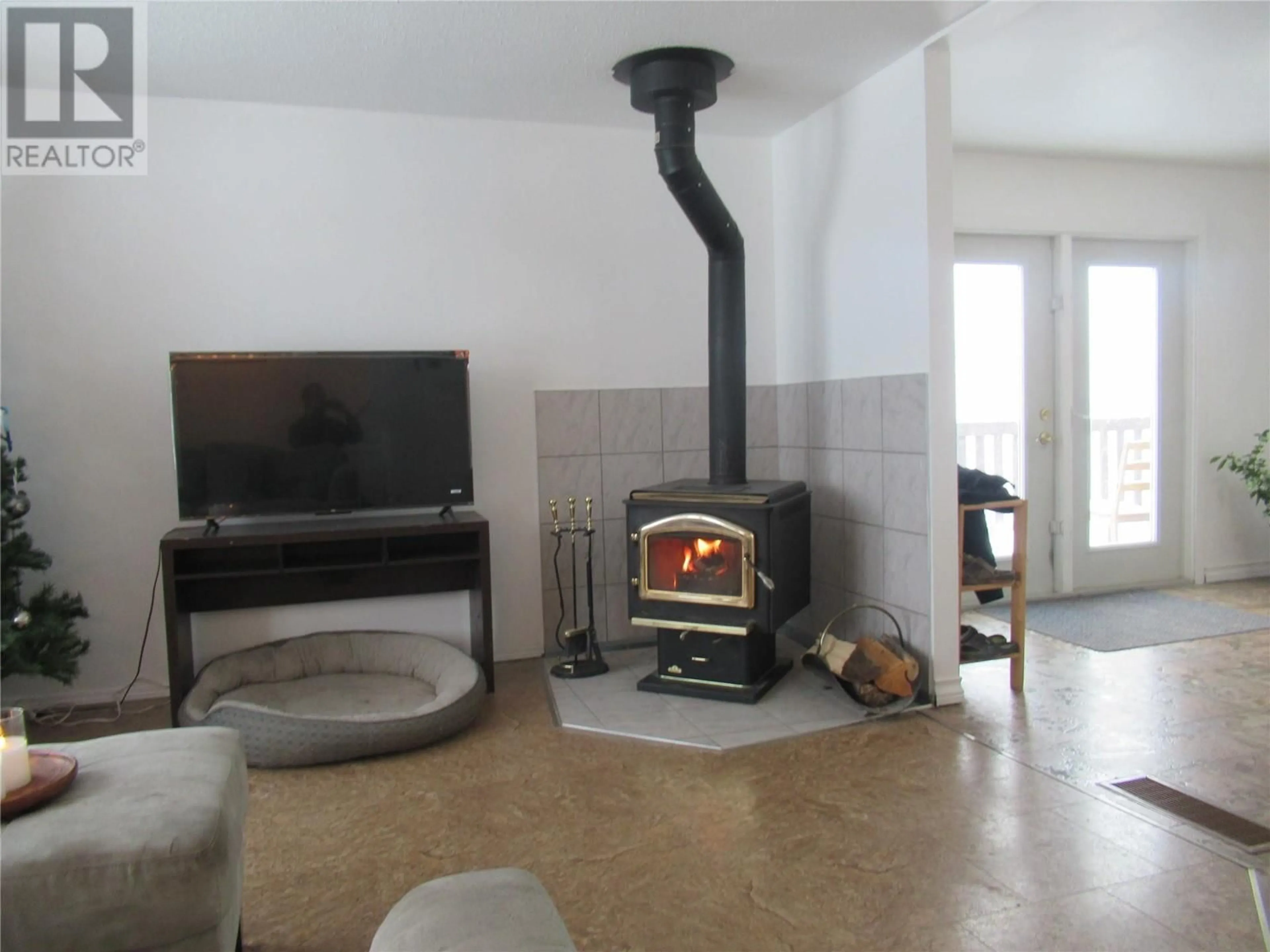 Living room, cement floor for 4909 55 Avenue, Pouce Coupe British Columbia V0C2C0