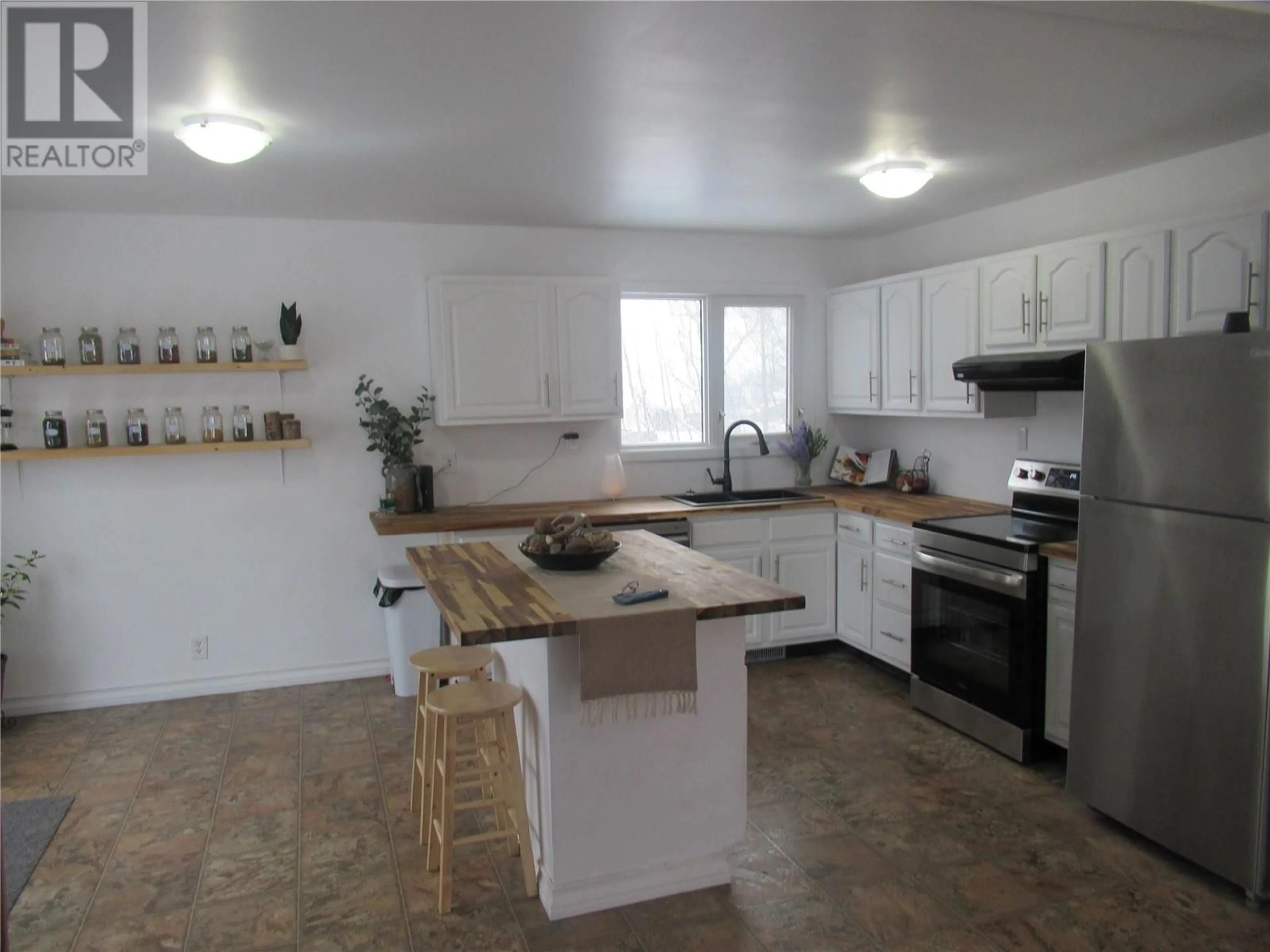 Open concept kitchen for 4909 55 Avenue, Pouce Coupe British Columbia V0C2C0