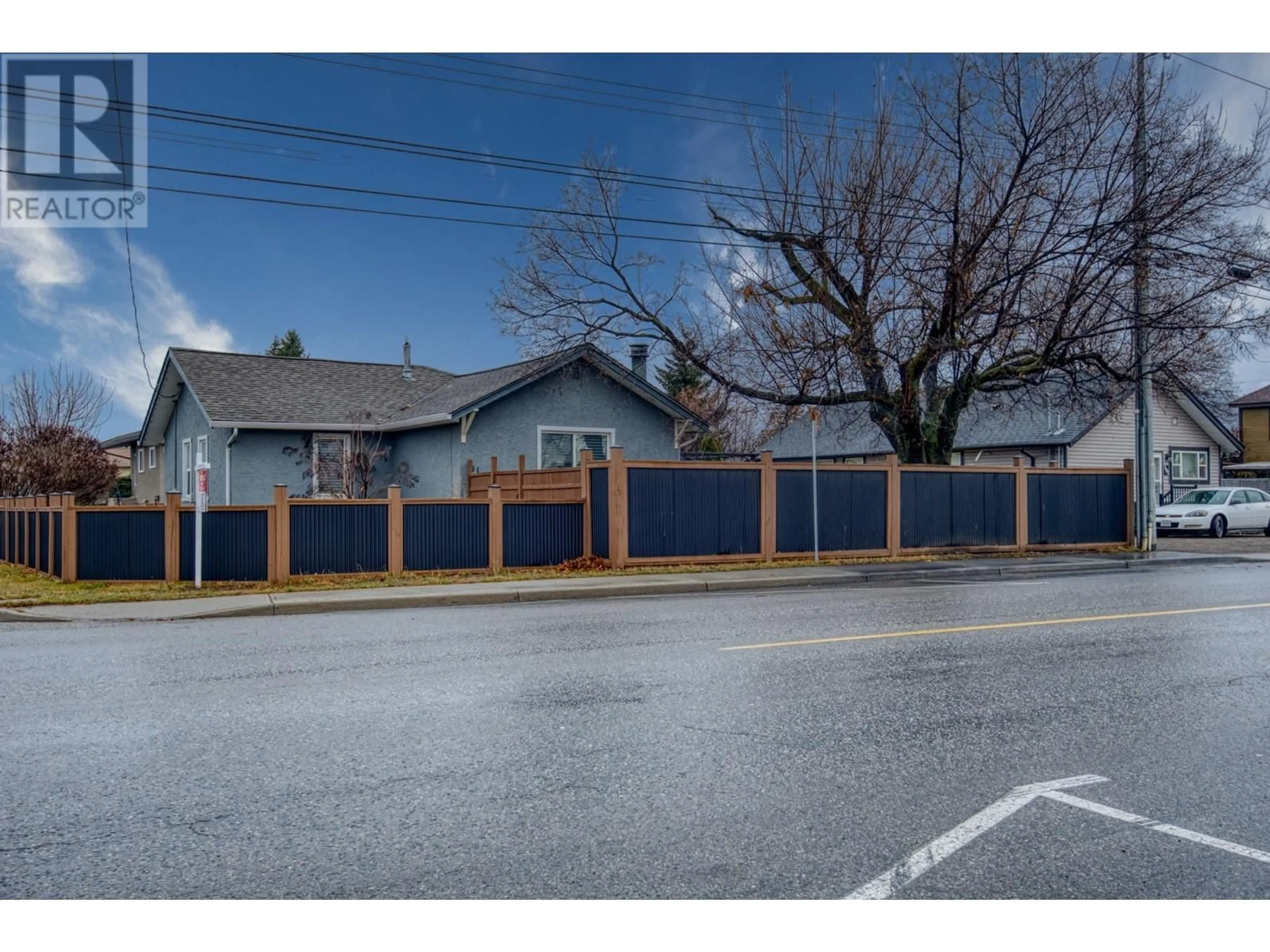 Frontside or backside of a home, the fenced backyard for 511 Duncan Avenue W, Penticton British Columbia V2A2V8