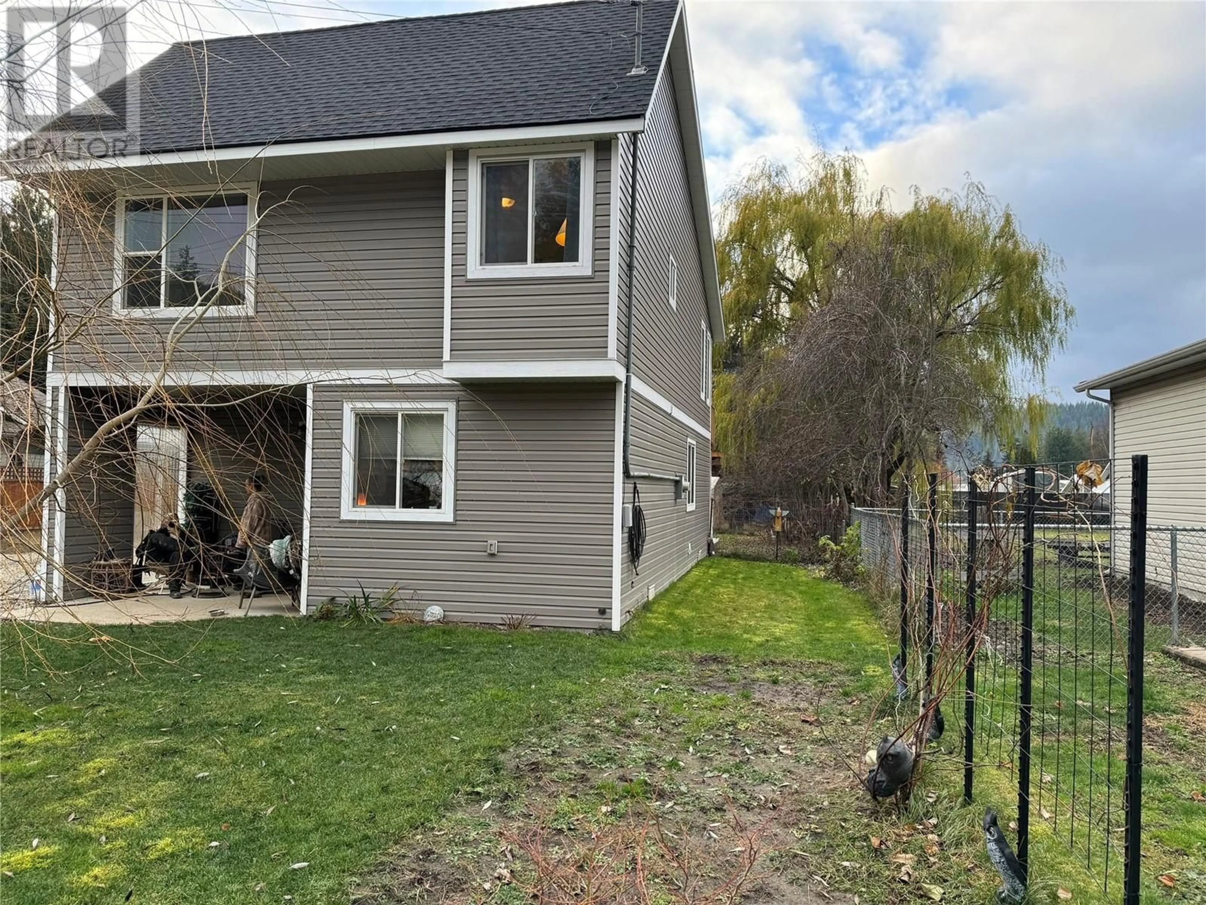 Frontside or backside of a home, the fenced backyard for 434 Maduik Avenue, Sicamous British Columbia V0E2V1