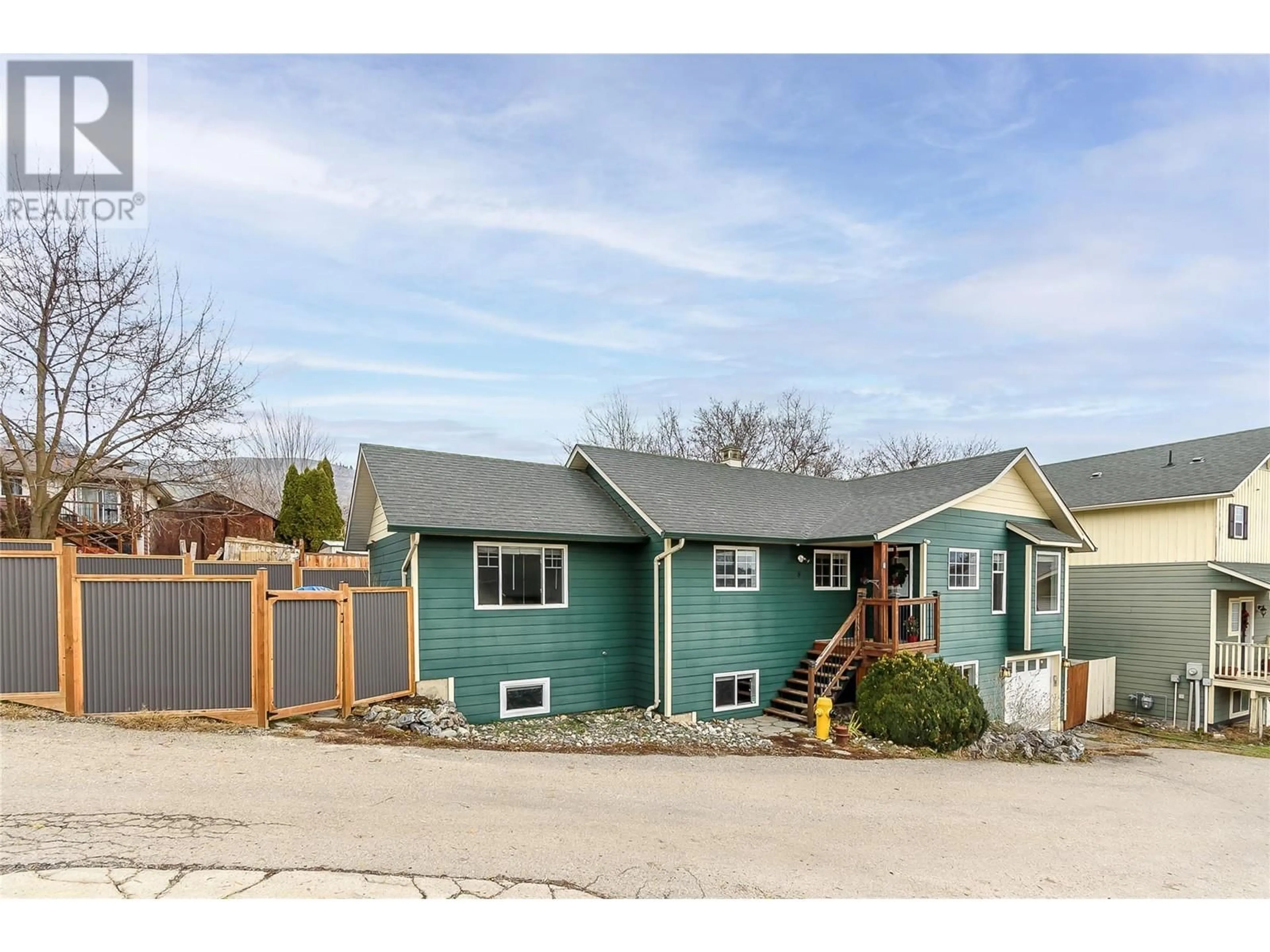 Frontside or backside of a home, the fenced backyard for #8 4909 27 Avenue, Vernon British Columbia V1T9V4