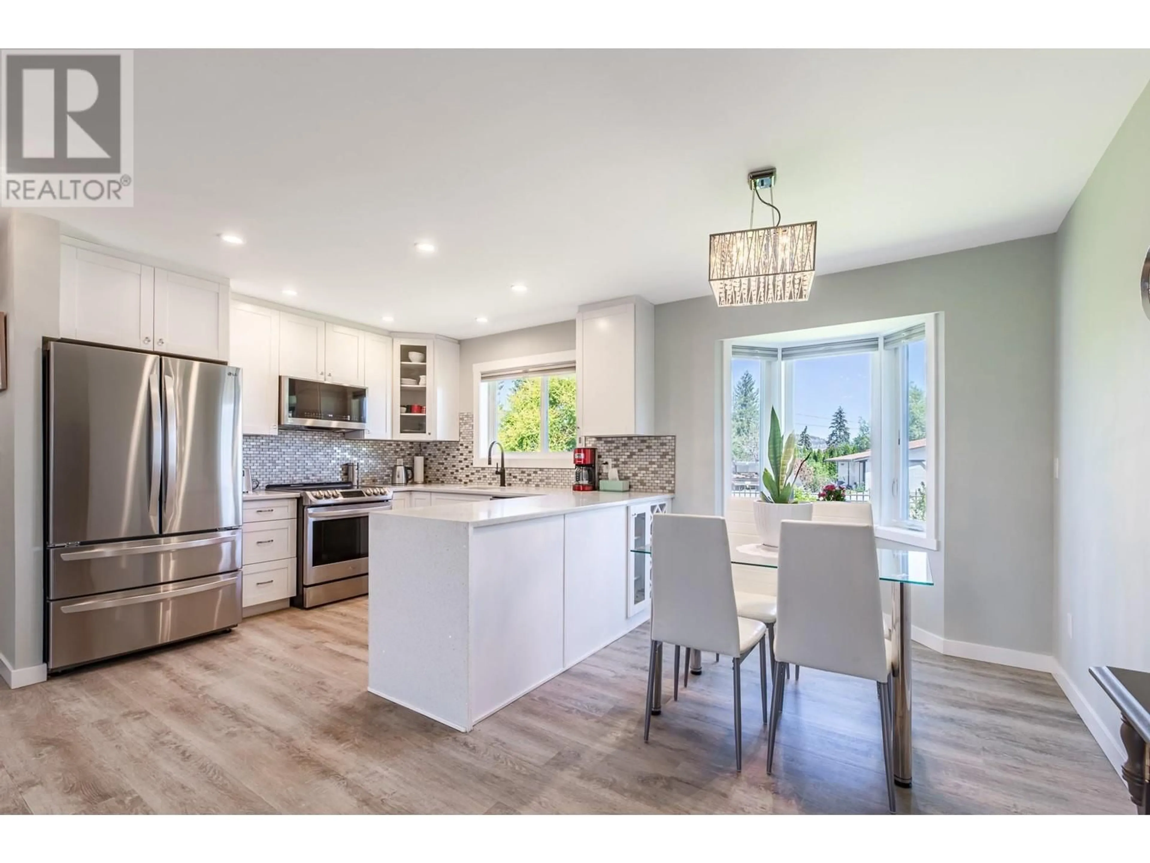 Open concept kitchen for 10105 Prairie Valley Road, Summerland British Columbia V0H1Z2