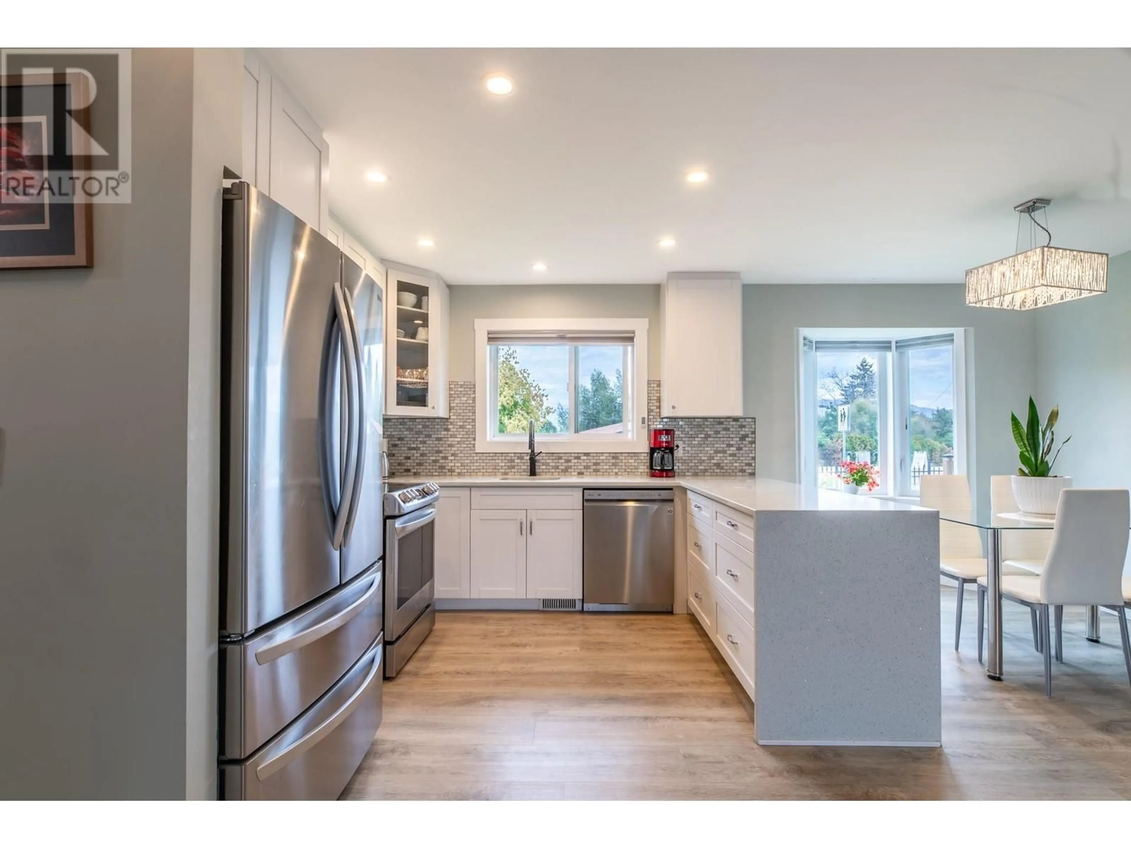 Open concept kitchen for 10105 Prairie Valley Road, Summerland British Columbia V0H1Z2