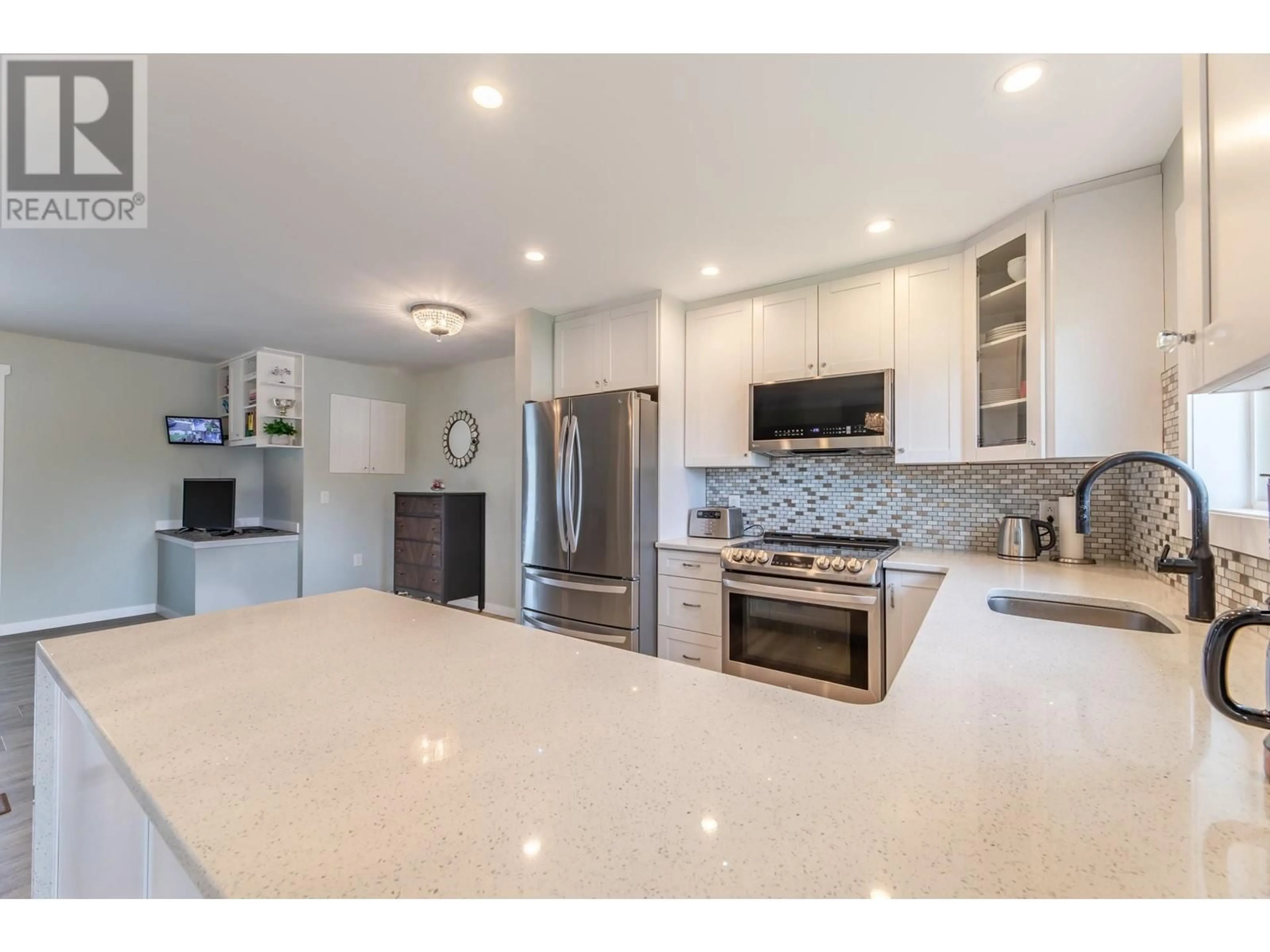 Open concept kitchen for 10105 Prairie Valley Road, Summerland British Columbia V0H1Z2